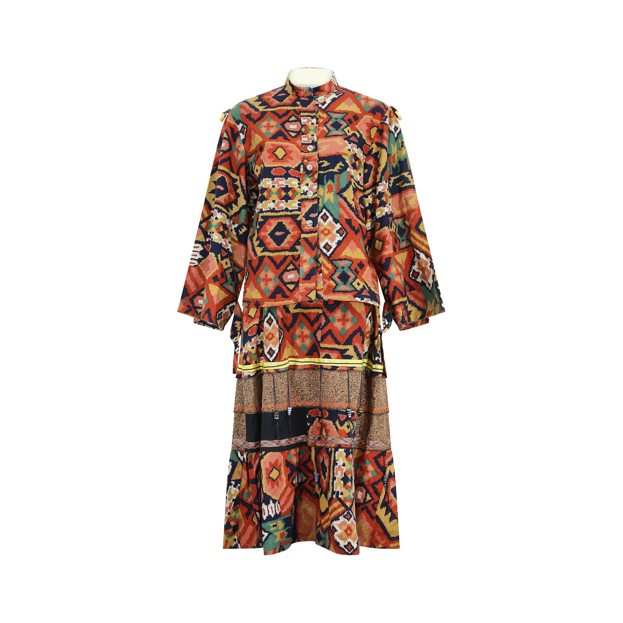 This coordinating skirt and jacket was designed by Janet Moira, a short lived fashion boutique in Covent Garden in the late 1970s to early 1980s. It is tailored from soft, pure cotton flannel in a vibrant multi-hued print. A lightweight button-up