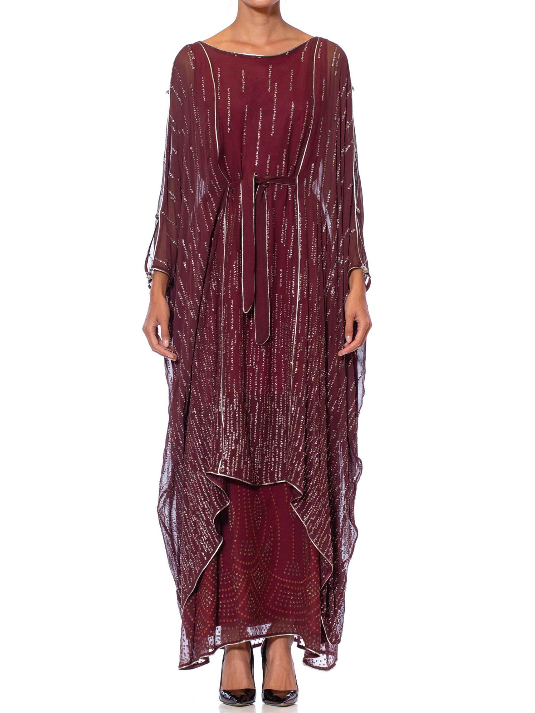 Adjustable to fit body with belt 1970S JANICE WAINWRIGHT Maroon Rayon Chiffon Goddess Sleeve Kaftan Style Gown With Crystal Buttons & Metallic Silver Detailing 