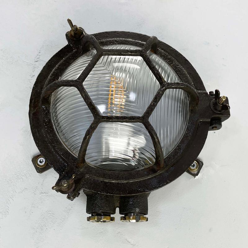 Industrial 1970's Japanese Black Cast Iron Circular Wall Light Hexagon Cage & Reeded Glass For Sale
