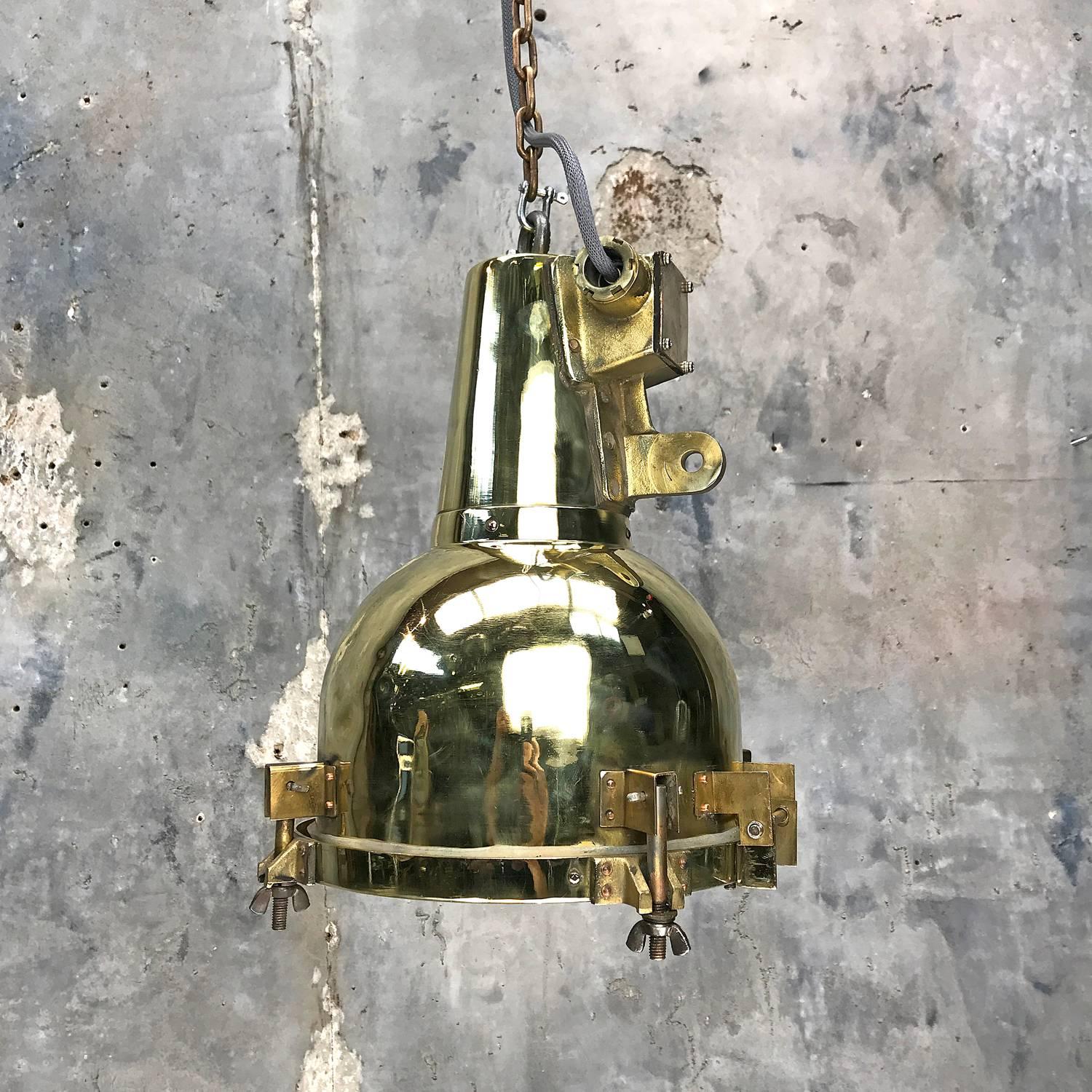 This compact fitting was salvaged from an old Japanese cargo ship built during the 1970s, These lights have travelled one million miles at sea!

We have expertly converted the search light to be a pendant for down lighting areas such as breakfast