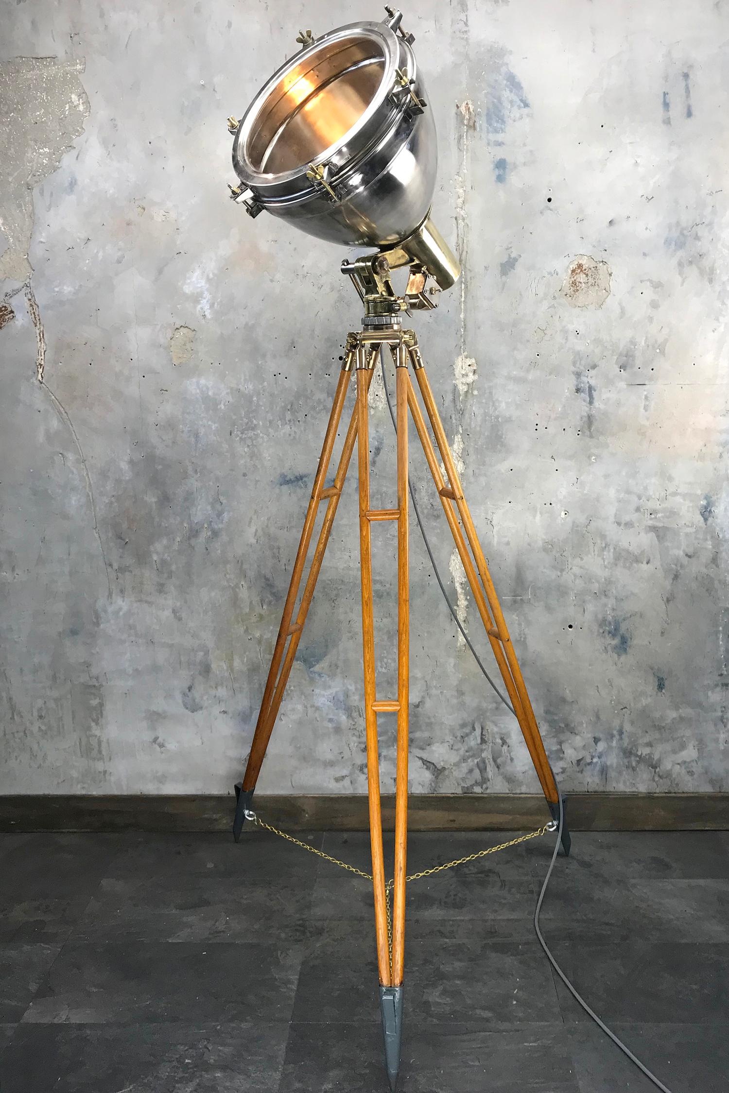 A fine example of a Loomlight tripod lamp comprising of a brass and stainless steel searchlight with timber and bronze tall tripod.

The lamp itself is a very substantial fixture with all wiring replaced with our in house wiring system and rocker