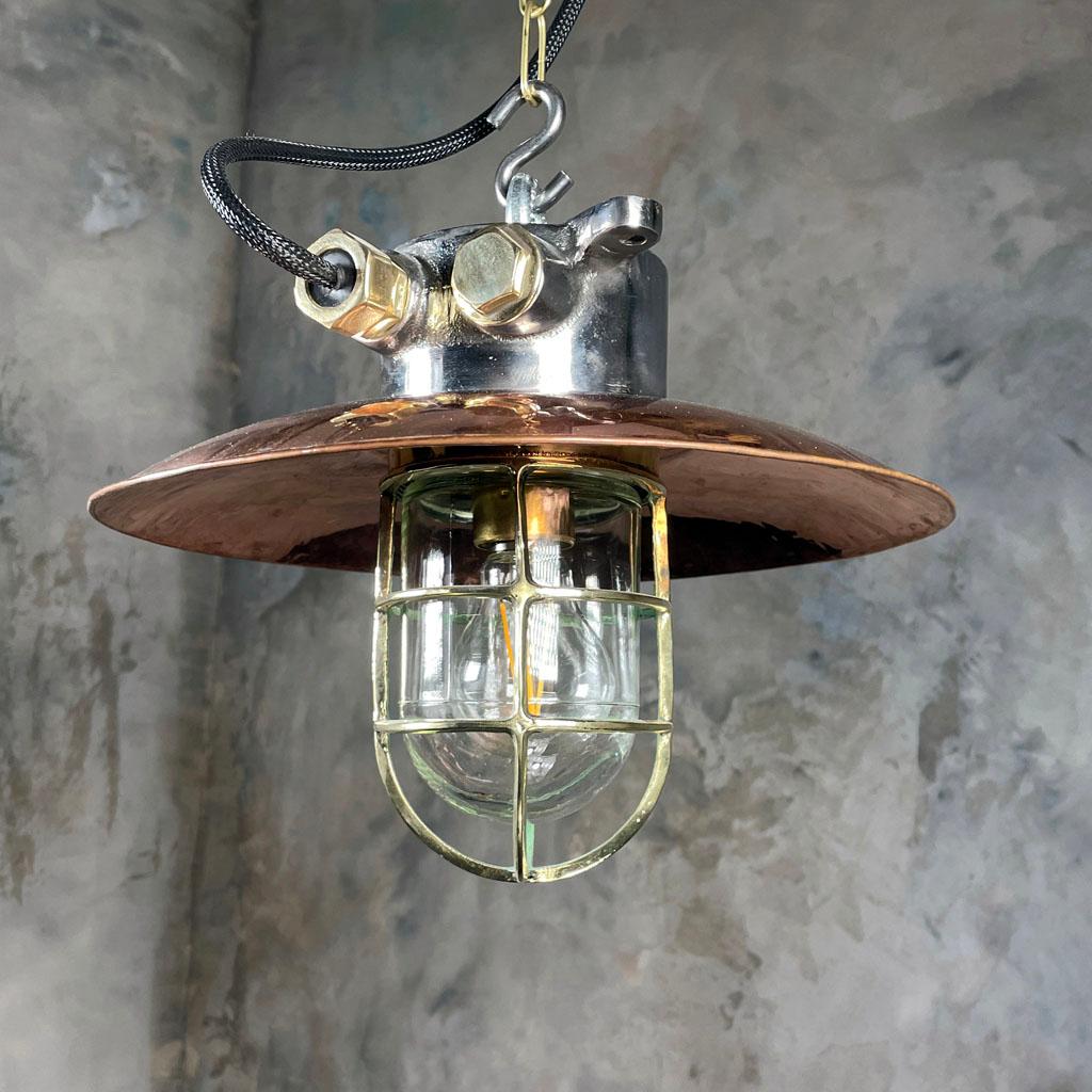 A reclaimed vintage Industrial explosion proof iron and copper cage light ceiling pendant. A solid metal light fixture with timeless design appeal.

Originally made in Japan and salvaged from 1970s cargo ships. 

Professionally restored by hand