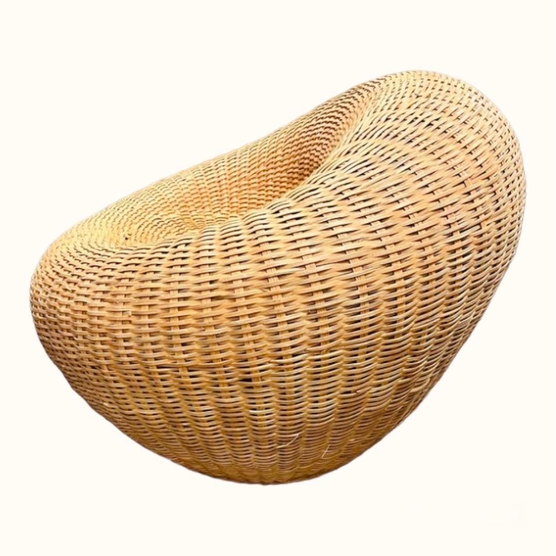 This is a vintage Japanese woven rattan nest chair. The piece is solid and is in extremely good condition. 