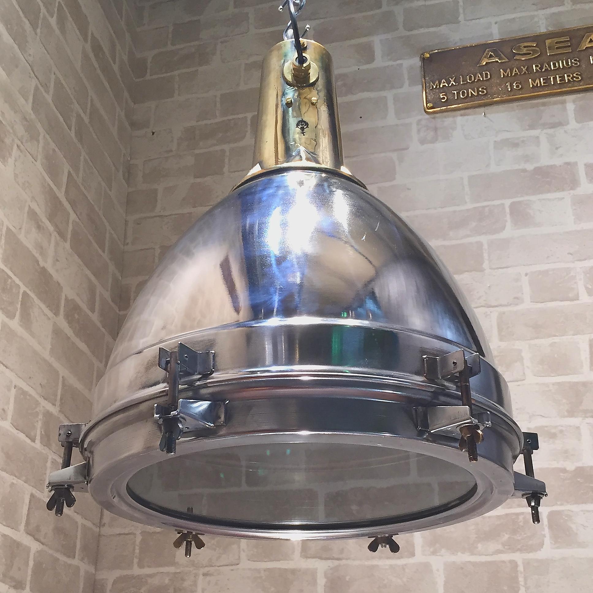 Original Stainless Steel, Cast Brass & Bronze Search Light Pendant Conversion
 
This very substantial fitting was salvaged from an old Japanese cargo ship, built during the 1970’s and is of outstanding build quality.
 
The Stainless dome is spun