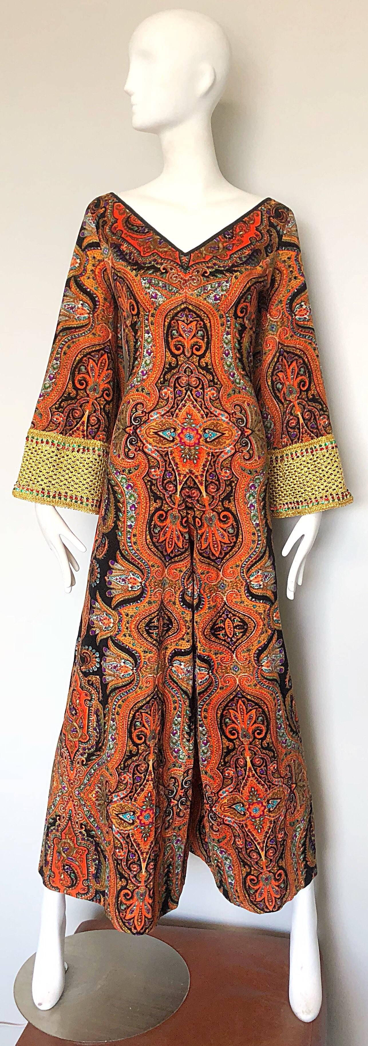 Incredible early 1970s JAY MORLEY for FERN VIOLETTE psychedelic paisley printed wide leg velour jumpsuit! Features a fitted bodice with forgiving flattering wide legs. Bell sleeves have gold embroidery with colorful sequins intertwined throughout.