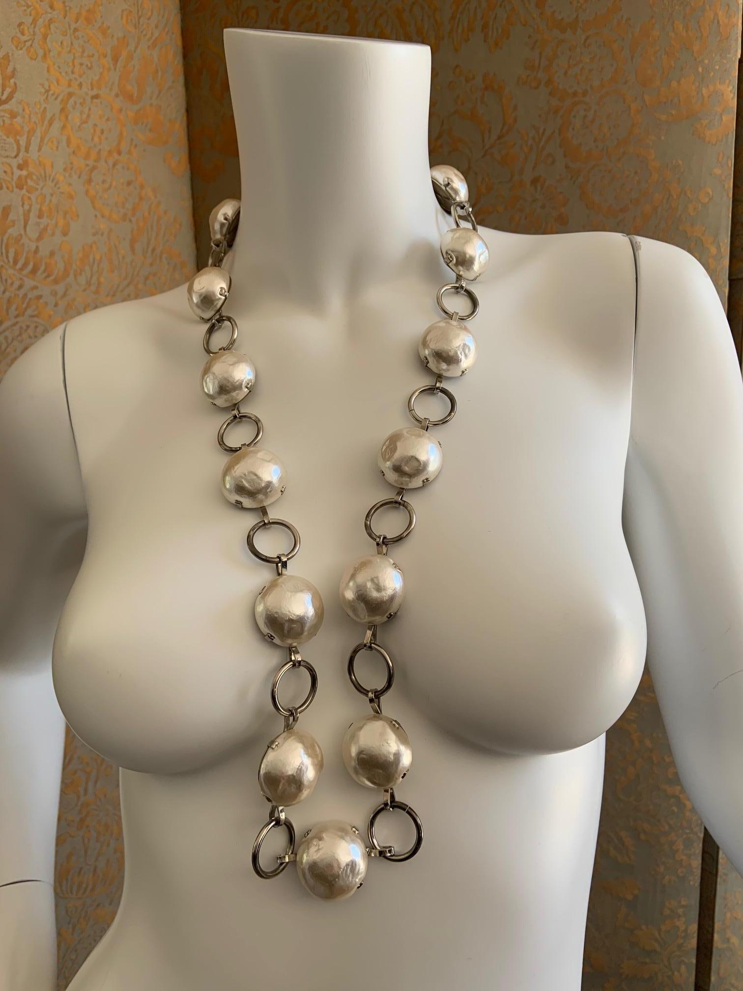 This gorgeous piece from Jean Patou, Paris is composed of alternating links of large blister pearls and silver toned metal rings. It can be worn as a belt or a necklace and it is in pristine condition.
Measurement;
Length 34