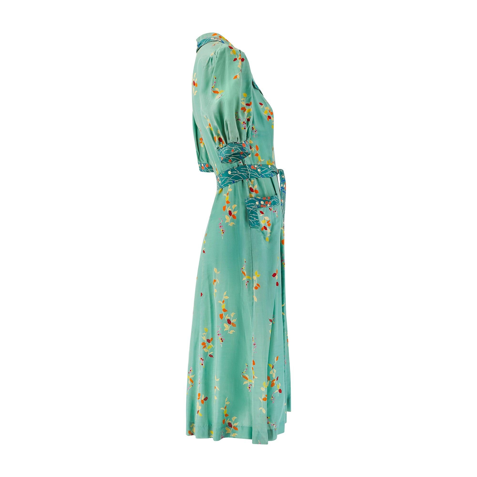 This 1970s does 1940s summer dress is by celebrated British designer Jeff Banks.  The influential designer was a pivotal member of the swinging 60s London fashion scene when he cofounded 'Clobber' in Blackheath Village, London, in 1964. The boutique