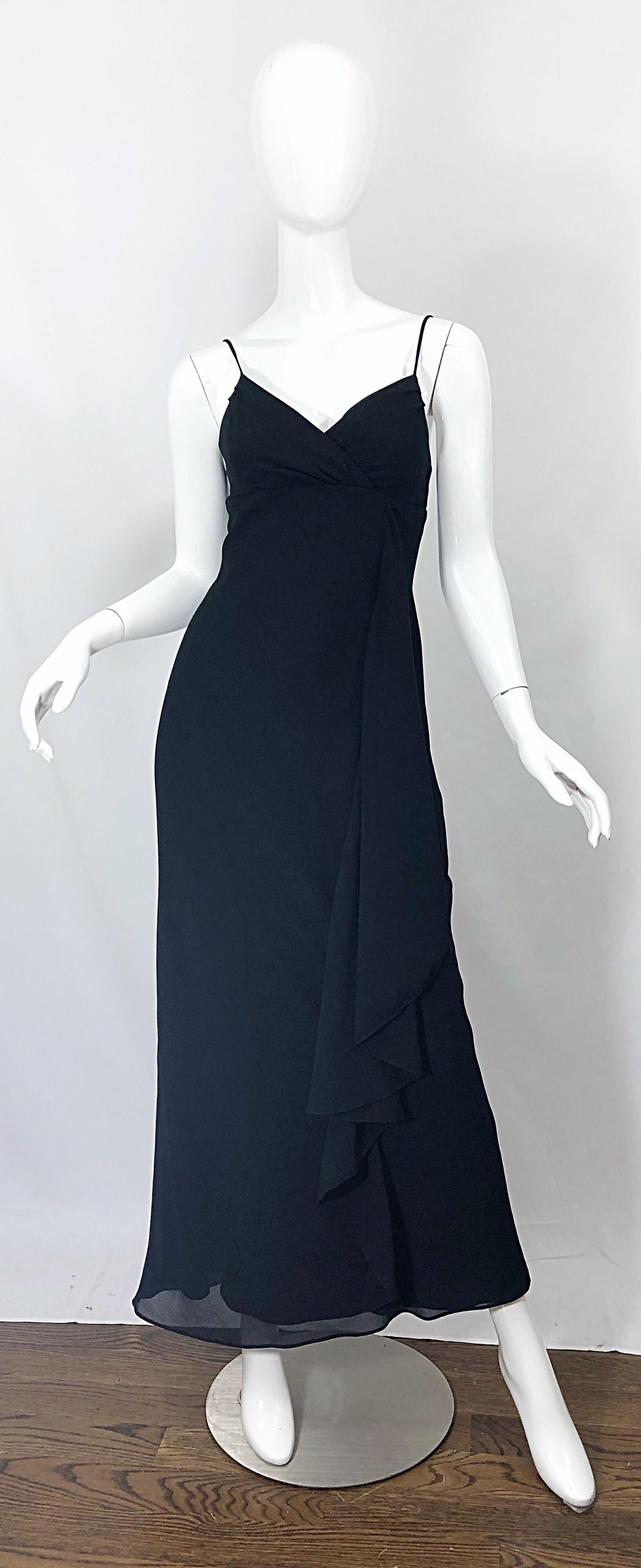Chic, classic and flattering 1970s vintage JODY T of California black spaghetti strap draped Grecian gown / maxi dress! Features a fitted bodice with a forgiving full skirt. Skirt features a ruffled drape on the left side of the skirt. Hidden metal