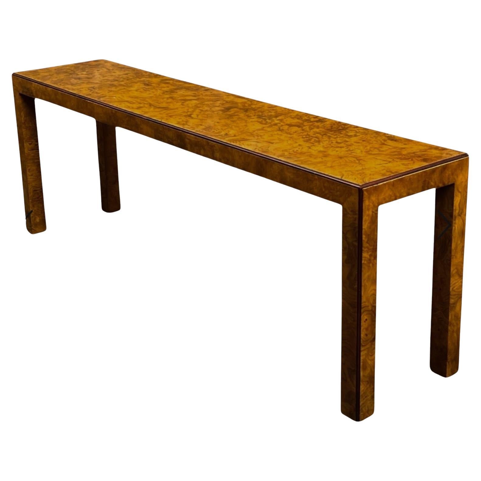 Timeless appeal! This is a modern burl Parsons style console table by John Widdicomb. With its clean lines and warm tones, the piece can work in a variety of design schemes. It dates to the 1970s and is in very good condition.