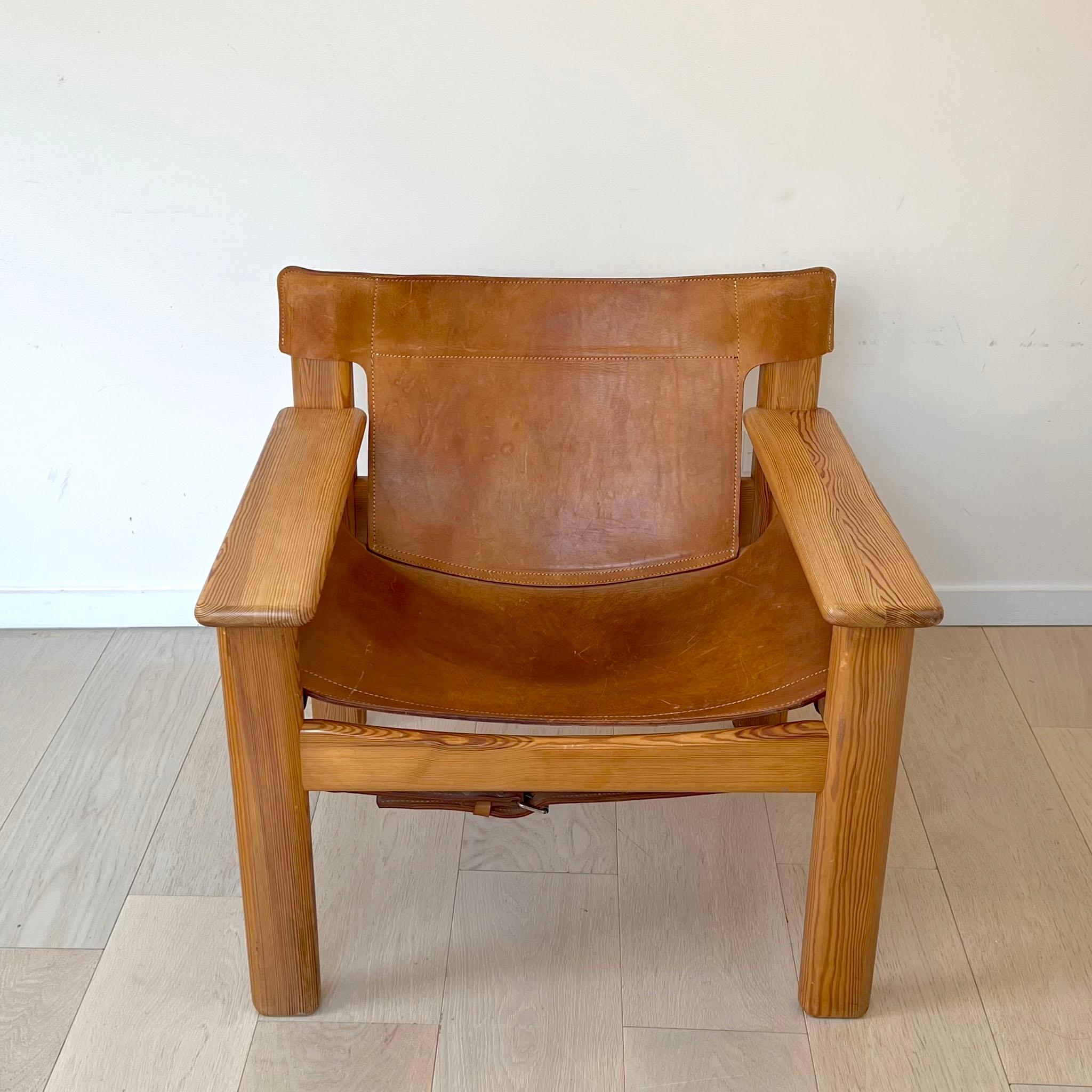 Swedish Designer Karin Mobring designed chair with thick saddle leather seat and pine frame. In the style of Borge Mogsen's well known Spanish Chair of the same era. This collectible chair is sturdy and comfortable. The leather seat has a nice