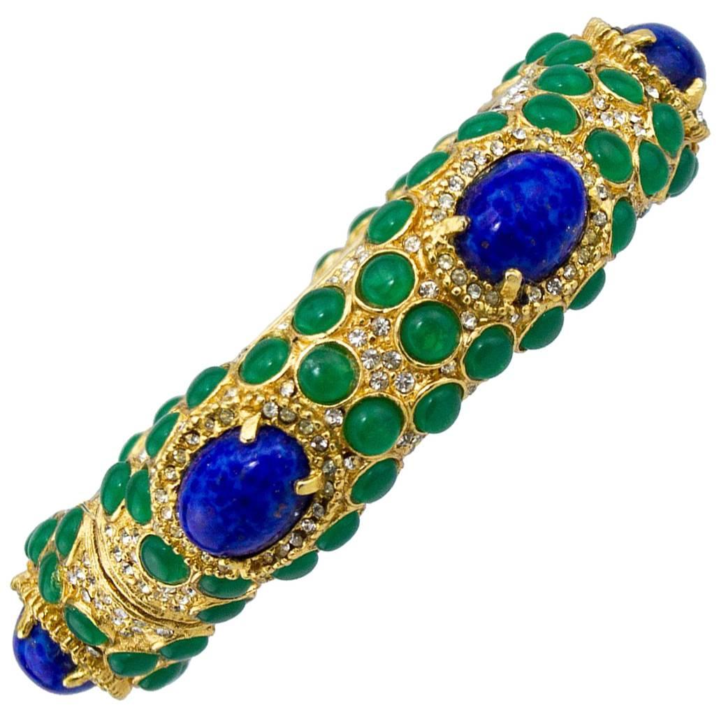 1970s Kenneth Jay Lane Gold Tone Bangle with Green and Blue Cabochon Stones