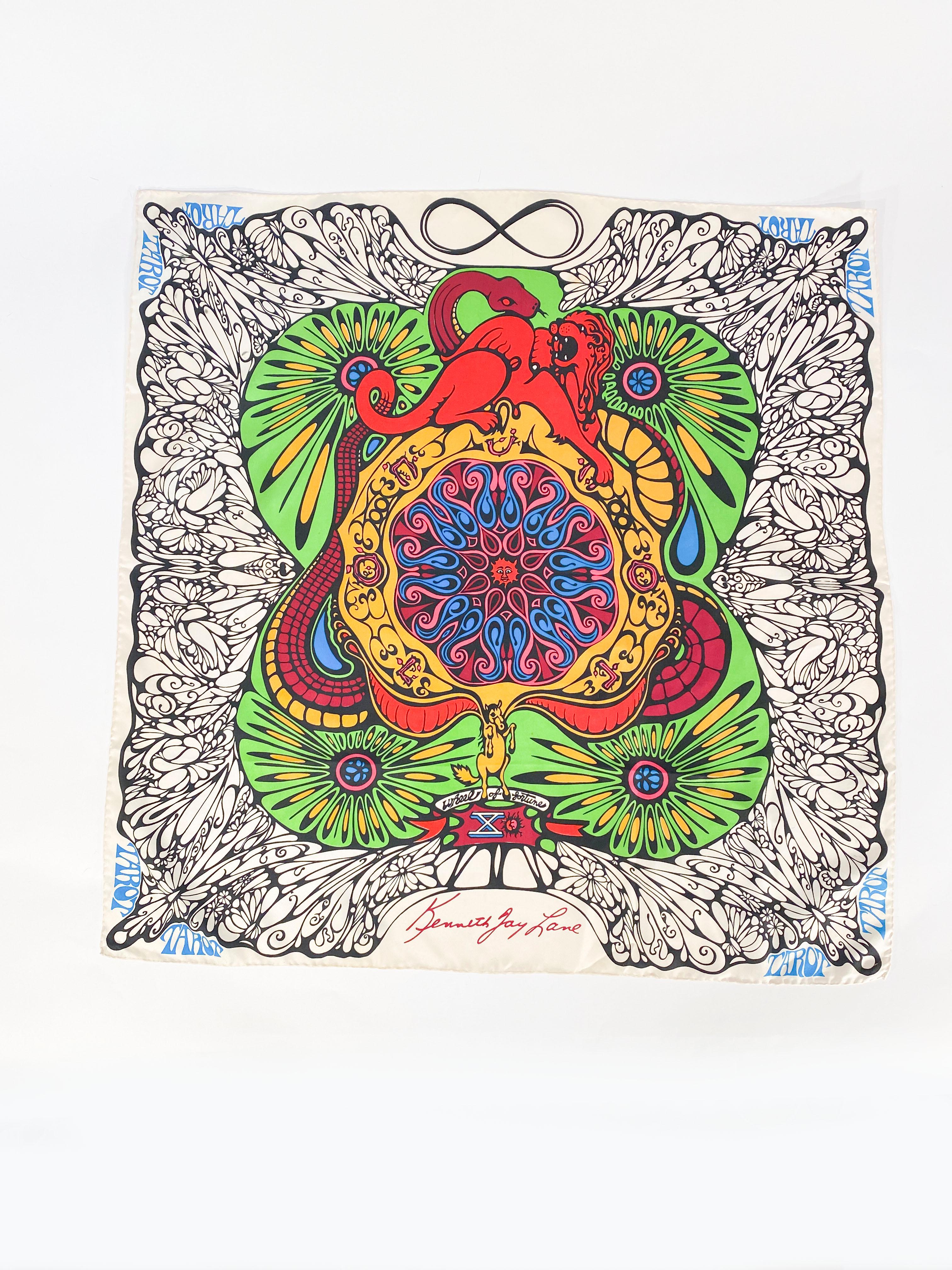 1970s Kenneth Jay Lane psychedelic printed scarf featuring psychedelic motifs in green, yellow, pink, blues, and black. The edges are hand rolled and the fore-color is a cream that creates a stark contrast with the bold line work in the illustration.