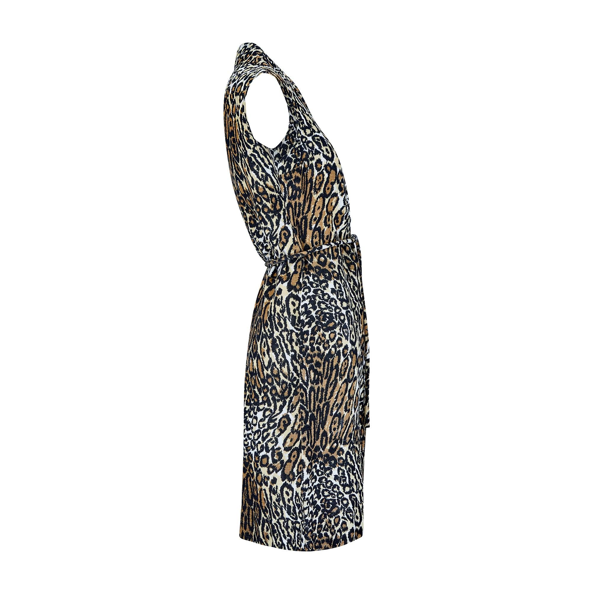This dress was made by dress manufacturing company Kenrose in the late 1960s to early 1970s. It showcases a flamboyant leopard print on thick, textured rayon which has the look and feel of high quality linen. It is tailored to a laid-back,