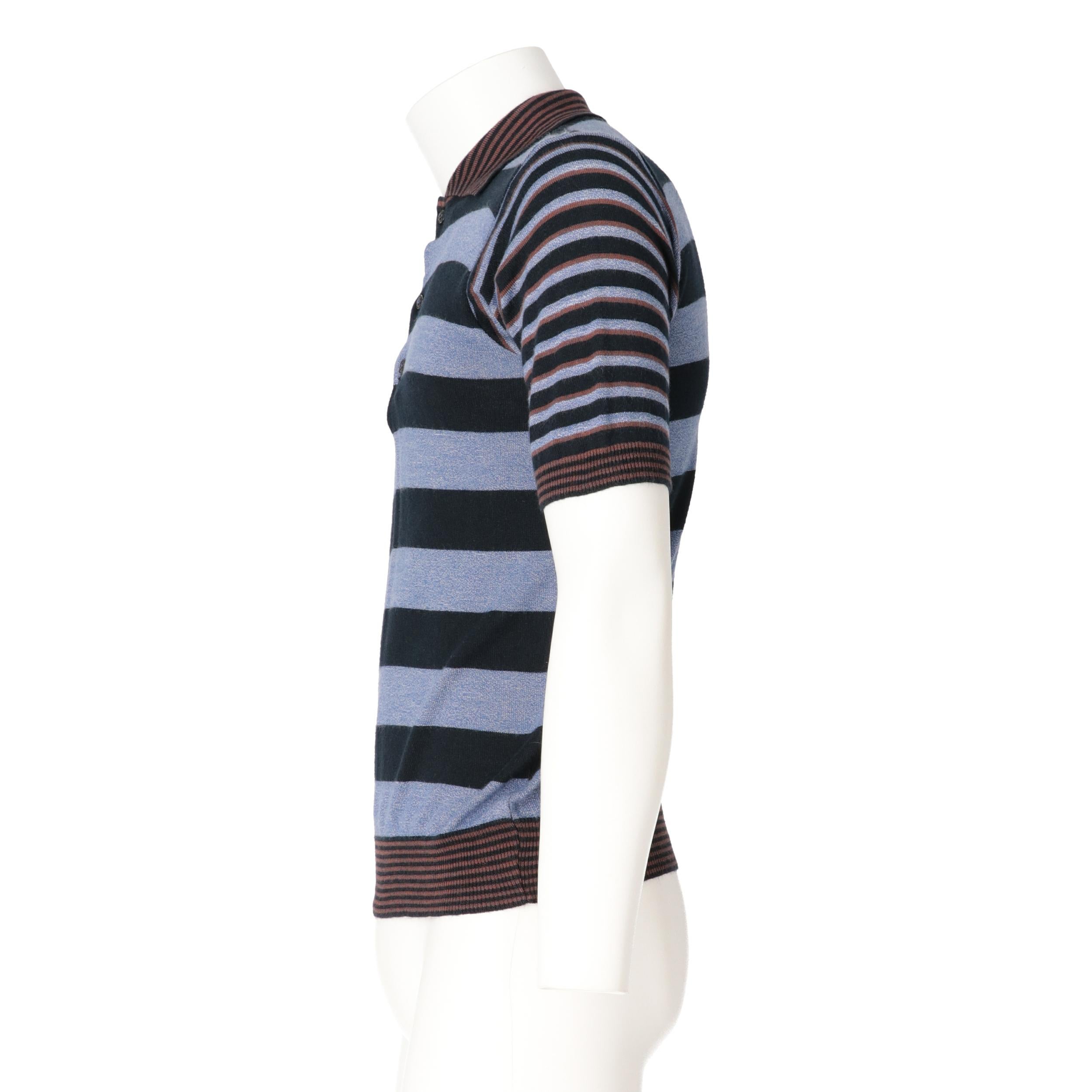 Kenzo blue, blue, black and brown striped cotton knit polo shirt. Classic collar and three front buttons.
Years: 70s

Made in France

Size: 46 IT

Linear measures 

Height: 60 cm
Bust: 46 cm
Shoulders: 42 cm
Sleeves: 24,5 cm