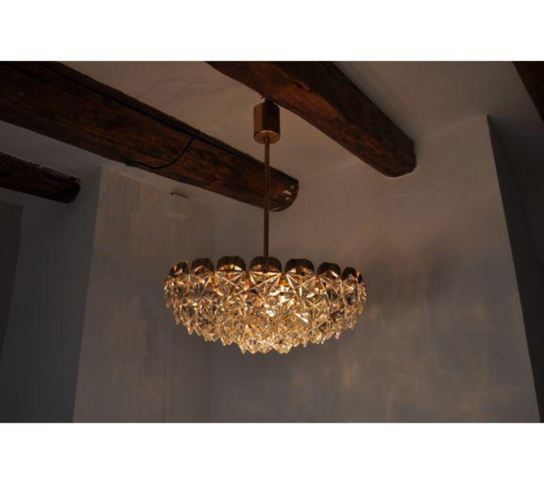 Impressive Kinkeldey chandelier designed and produced in Germany circa 1970s. Metallic gold platted structure with 6 levels and 83 crystals. A unique piece of design that will be a great highlight to your interior project. Object in mint conditions.