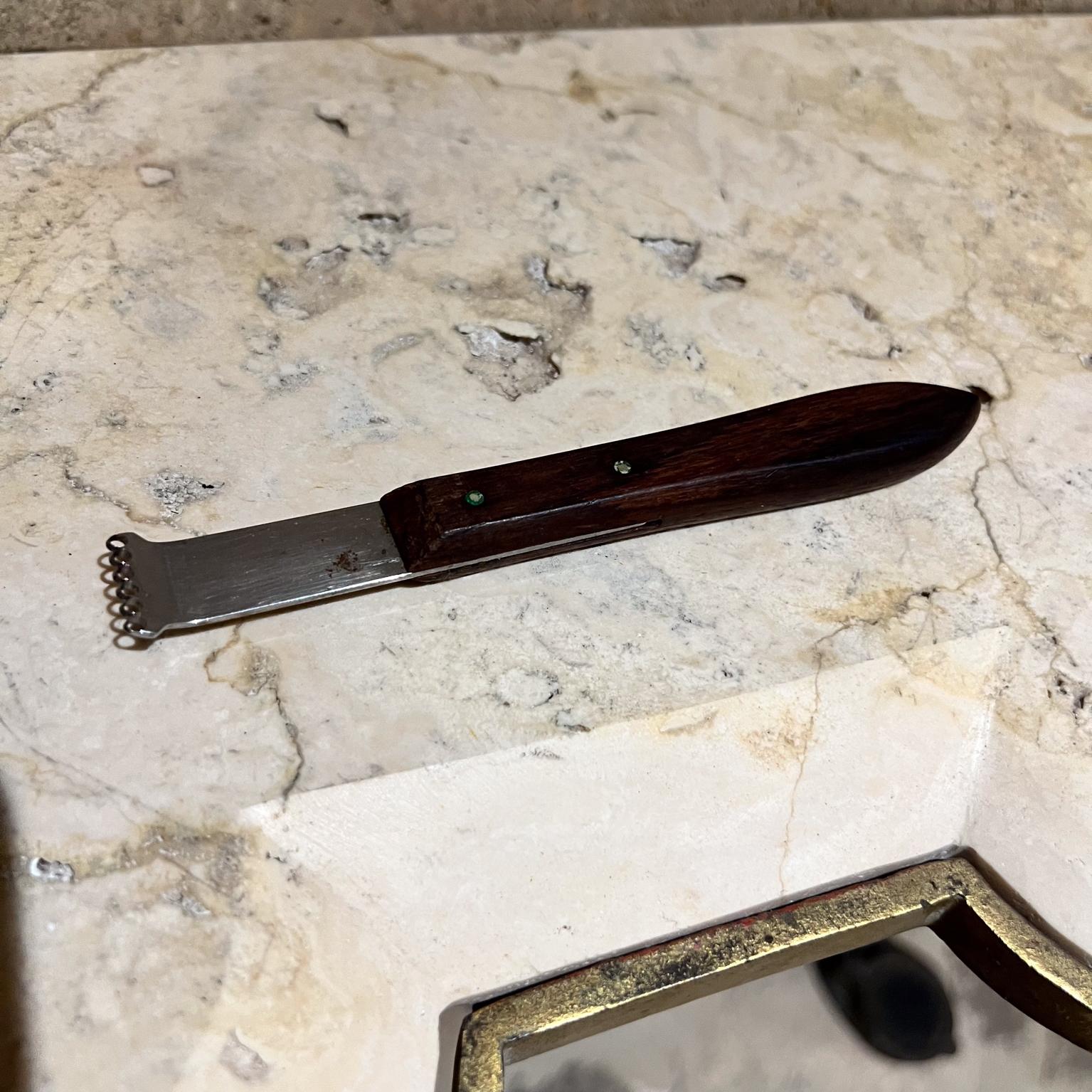 Lemon Zester Kitchen tool for garnishing fruit zest slivers 
stainless steel
Victorinox Switzerland
.5 x 6 x .75 w
Preowned vintage, refer to images.
