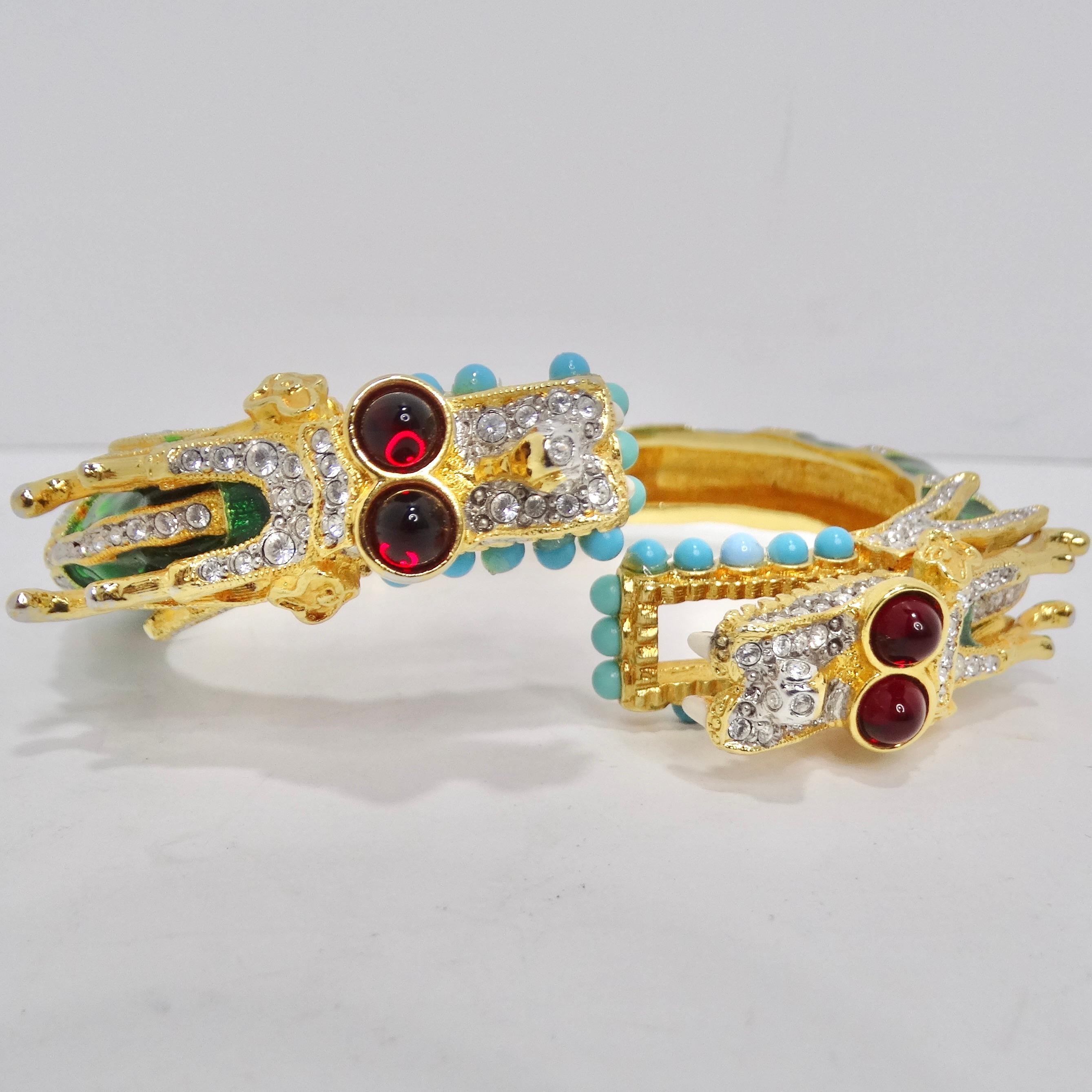 Transport yourself back to the glamorous and eclectic fashion of the 1970s with our exquisite KJL Multi Stone Dragon Head Bracelet. This clamper bracelet is a true work of art, capturing the essence of an era marked by bold and extravagant style. At
