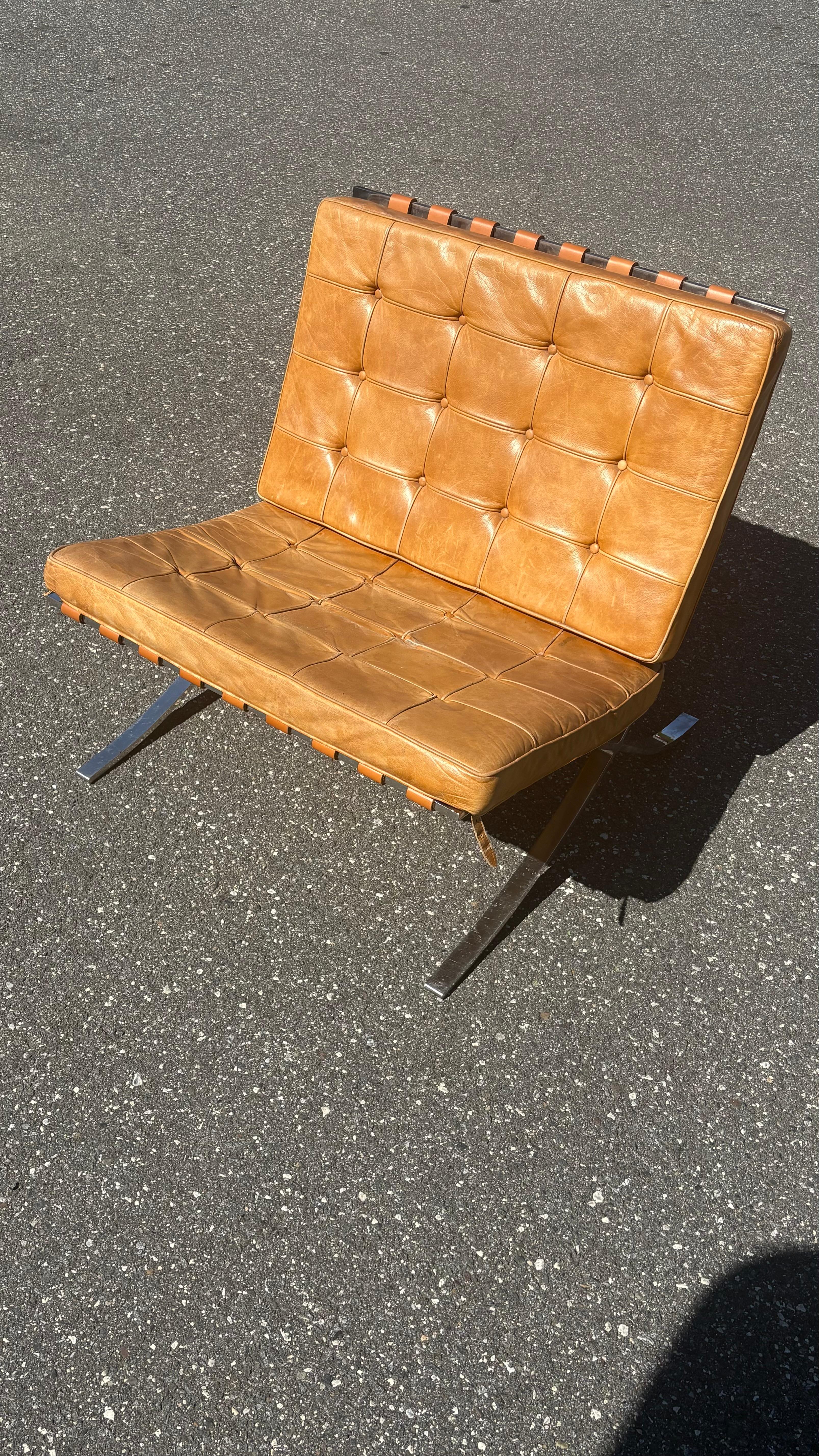 A wonderful example of a vintage Barcelona chair in nicely patinated cognac leather. 

These are becoming increasingly difficult to find. 

Label is present. New straps. Original leather cushions. 

Ships from Philadelphia. 

Photos show chairs in
