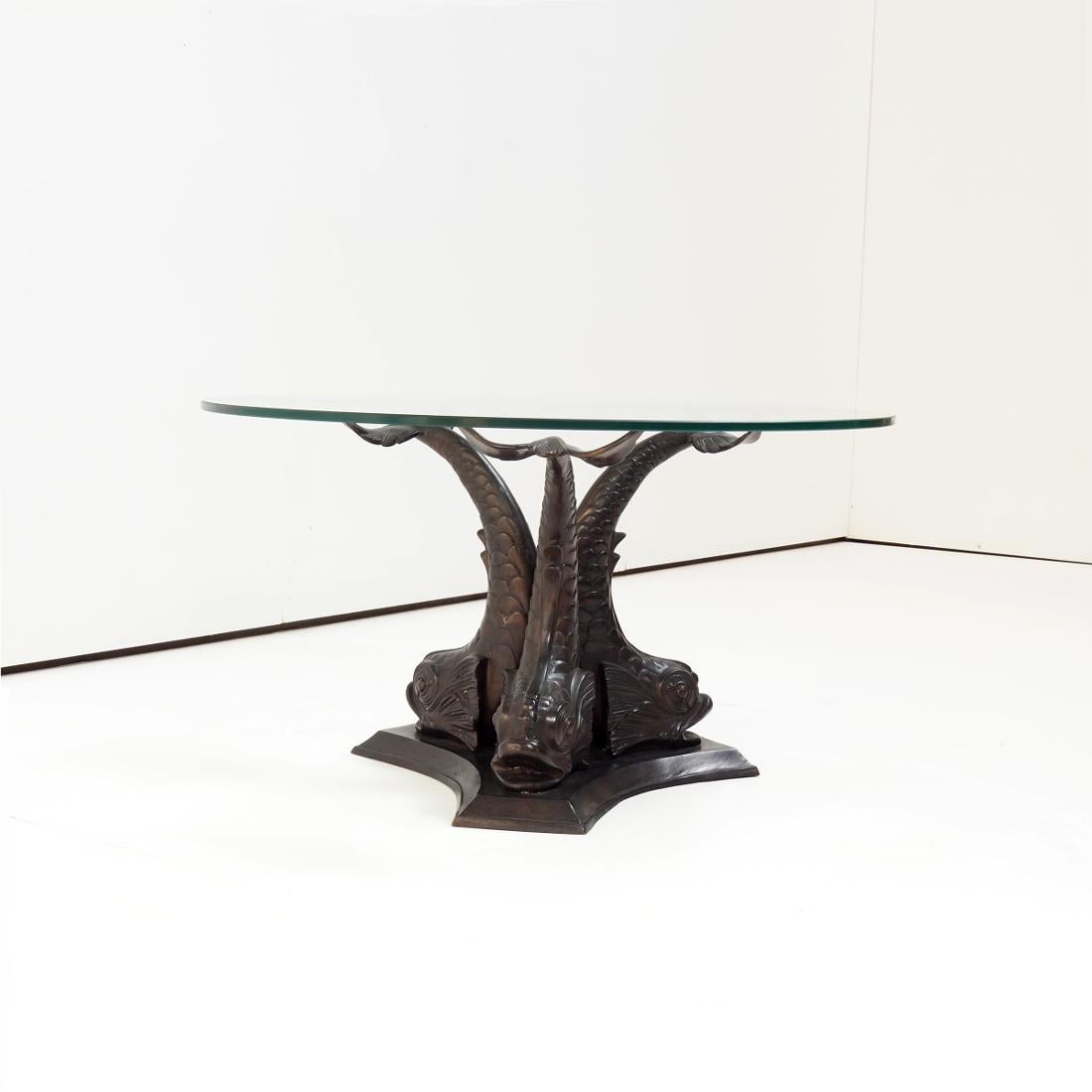 1970’s  Italian coffee table in Hollywood Regency style. It has a ‘Koi Fish’ base and a beautiful thick glass top. In full original condition.

The bronze base is naturally colored due to age and shows hardly any wear and tear.

H x w x d = 19,7 x