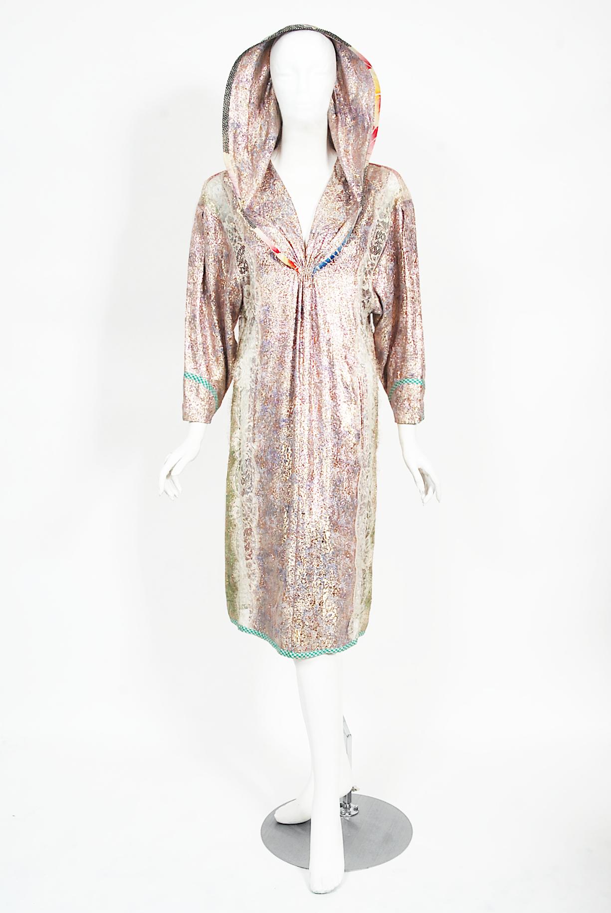 A magical and incredibly rare Koos Van Den Akker couture hooded dress dating back to the mid 1970's. Koos was especially known for the incorporation of collage into his work and he always started a garment from the love of textiles together. This