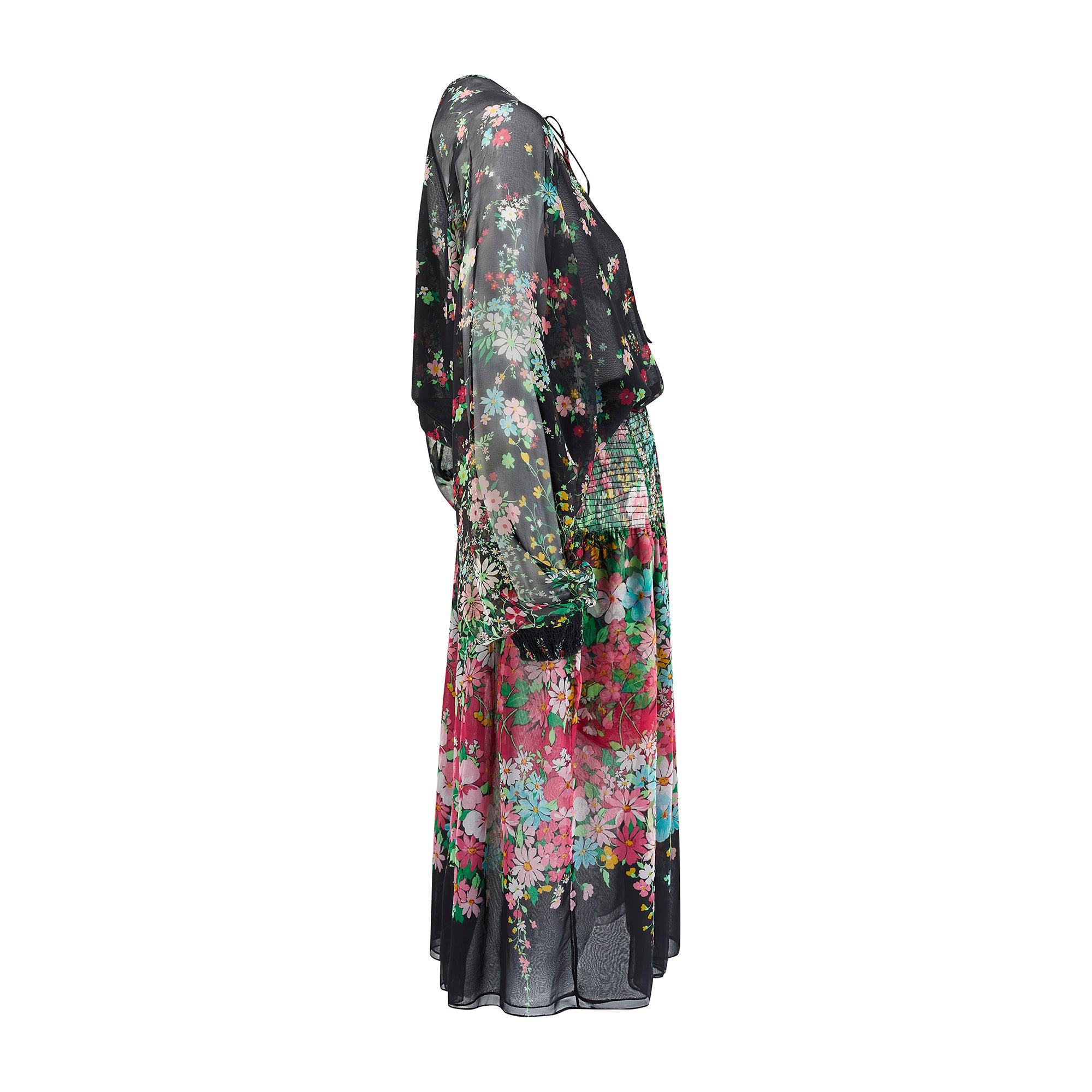 Vestido smock floral Koos Van den Akker de los años 70.  Se trata de un bonito y detallado diseño del famoso diseñador holandés, que se trasladó a Nueva York en 1968 desde La Haya (Países Bajos).  Era conocido por su trabajo textil y llamó la