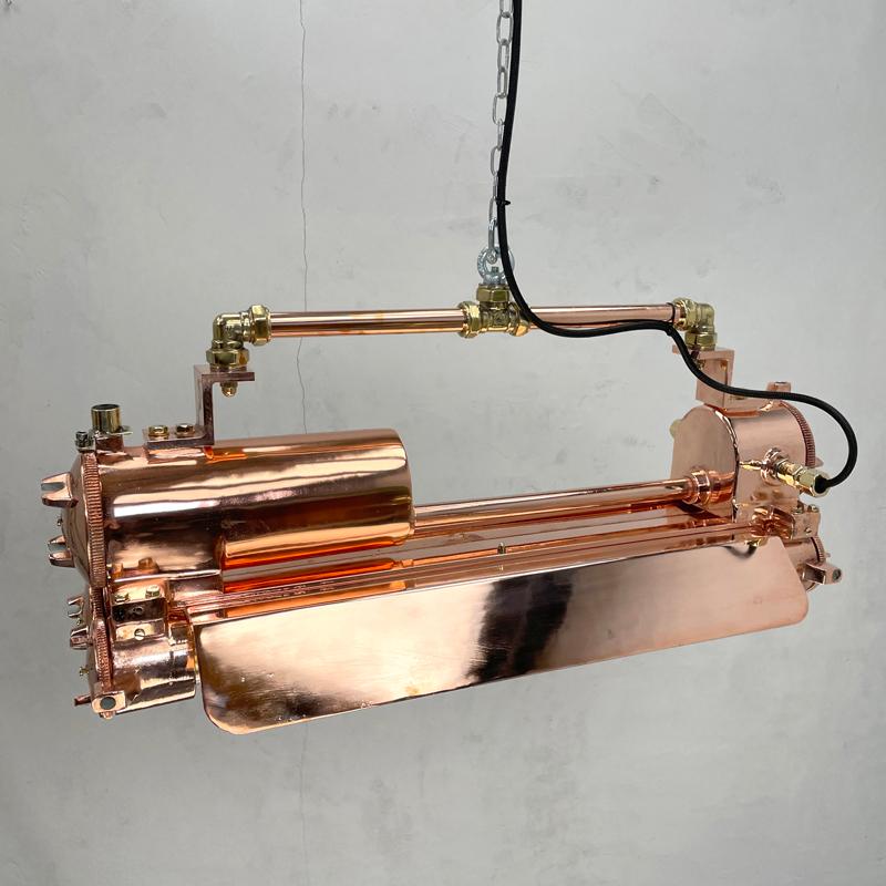 Vintage industrial copper flameproof Edison LED tube ceiling strip light with shades made by Daeyang in the 1970's, and reclaimed from supertankers and large sea going vessels.

These large industrial style ceiling light fittings are perfect for