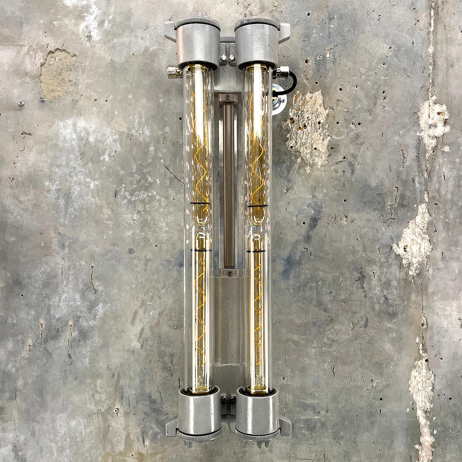 A retro Industrial aluminium flameproof wall-mounted twin LED tube strip light by Daeyang.

Originally these lights were manufactured circa 1970 for NATO vessels. Reclaimed and professionally restored by hand in UK by Loomlight to modern lighting