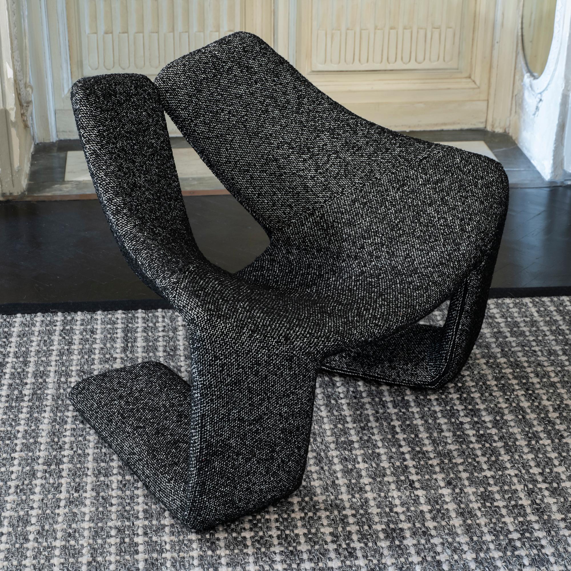 One of a kind pair of armchairs, original structure newly reupholstered in a black and white bouclé fabric, designed by Kwok Hoi Chan for Steiner, France 1970's.