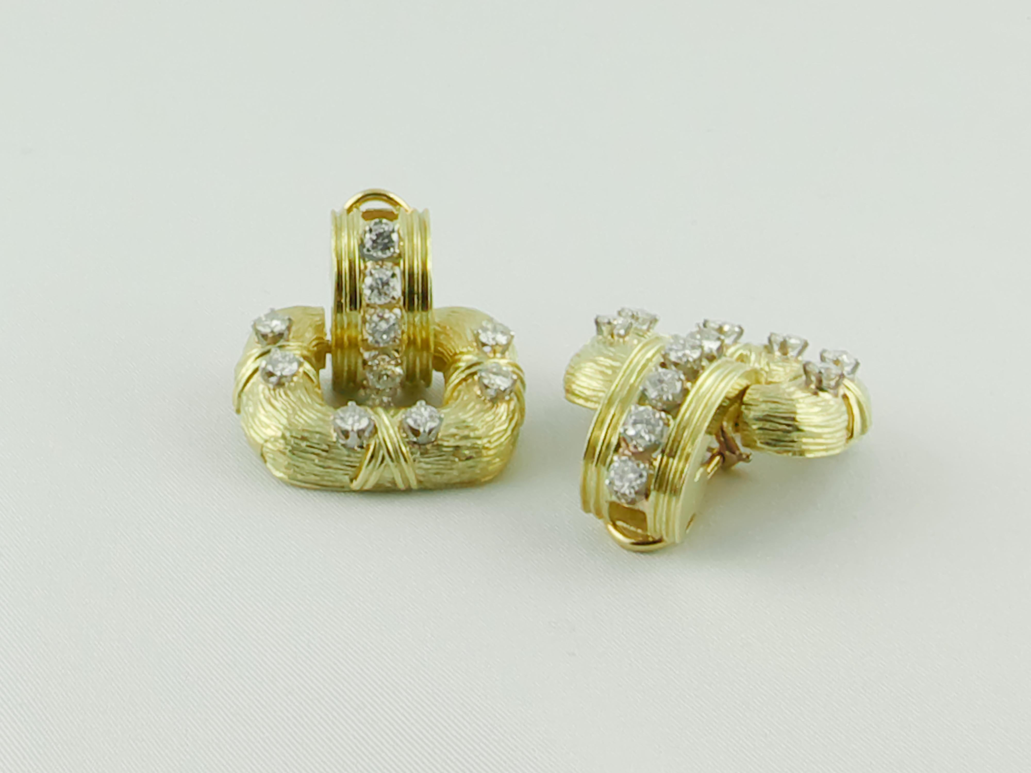 This stunning pair of 18 karat Yellow Gold and Diamonds Earrings was created in the 1970s by La Triomphe
La Triomphe used 18 kt textured Yellow Gold and approx  3cts round brilliant cut sparkling Diamonds to create an elegant Earring set. 
Crafted