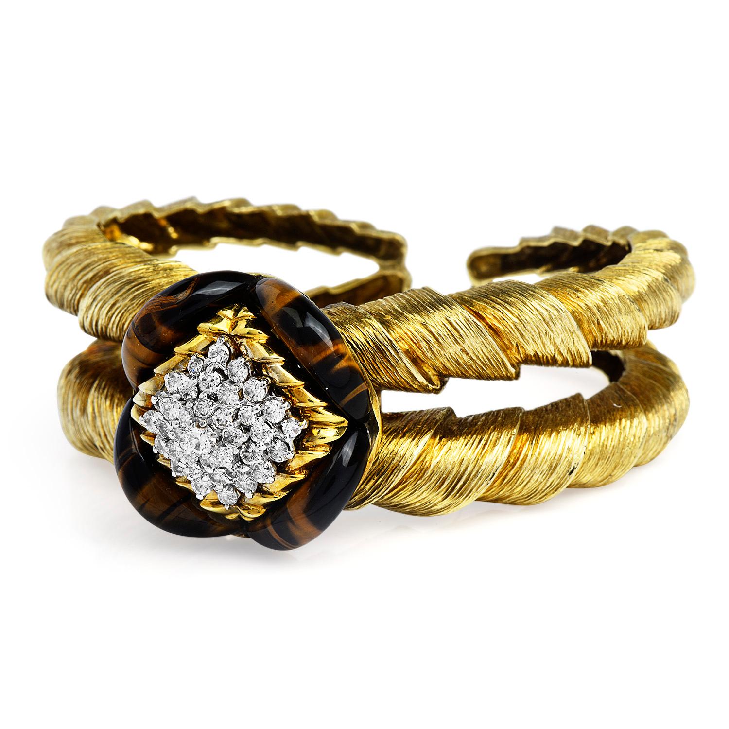 Higly Collectible La Triomphe Vintage Bracelet, 
This Circa 1970's piece is Centered by a flower design cluster of diamond & tiger eye gemstones, adorned with solid 14k gold cuff textured bracelet, inspired in ram horns,
This beautiful Cuff bracelet