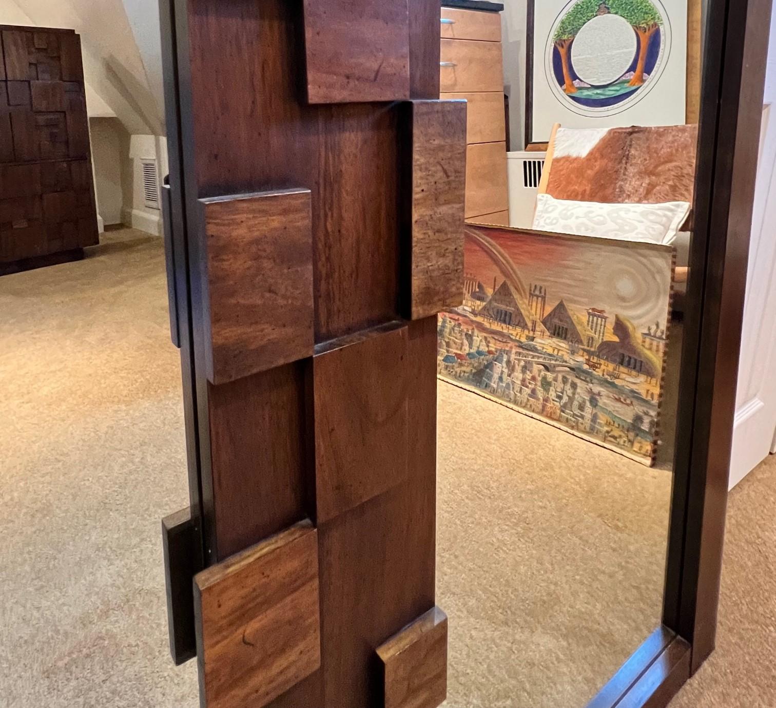 A mirror from one of Lane Furniture's classic 70's, Brutalist bedroom sets.. The frame is walnut with a walnut mosaic pattern in center flanked by two 19 x 37
