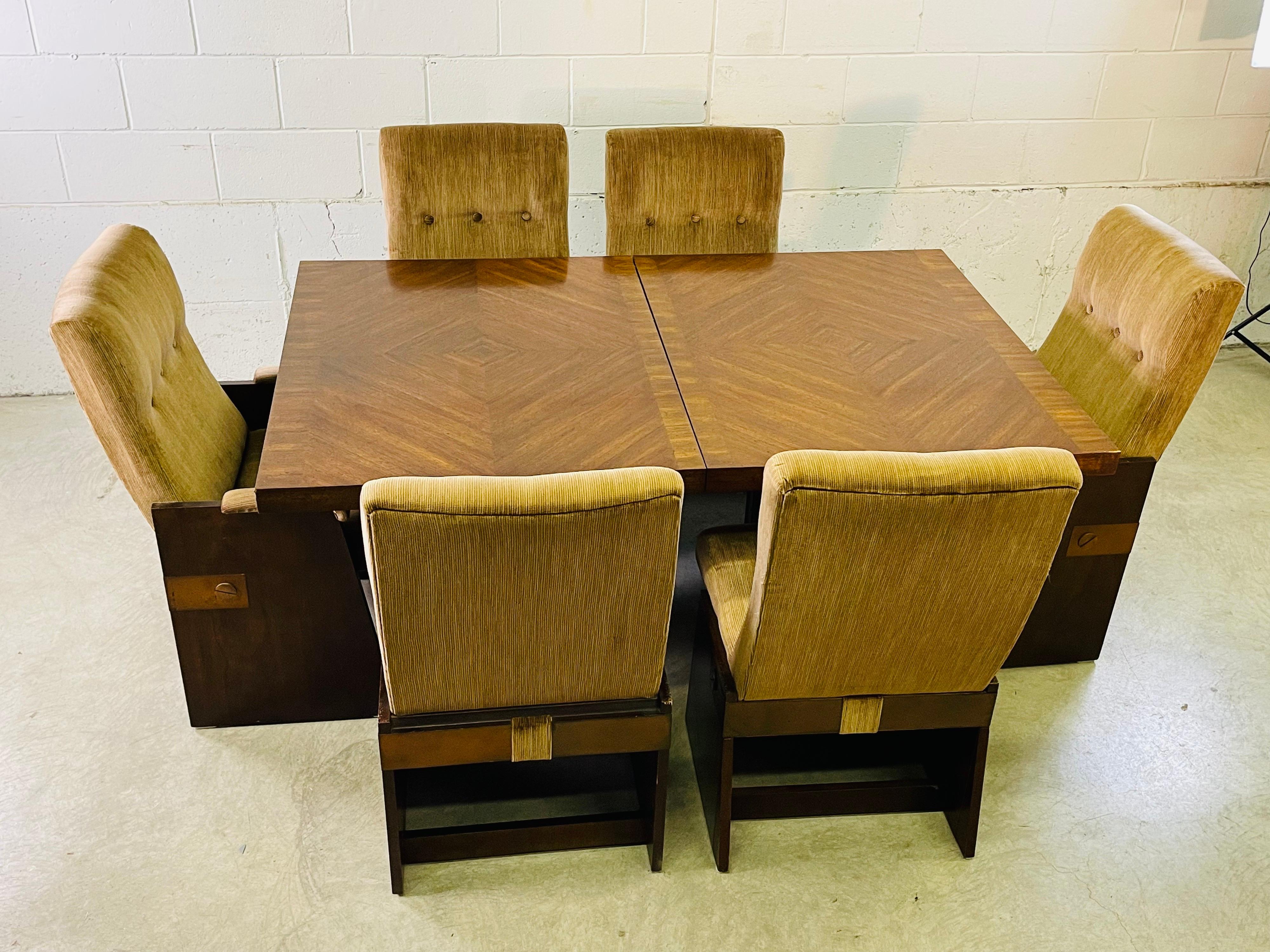 Vintage 1970s Lane Furniture Co Brutalist style dining room table with six chairs. The table has a nice inlaid chevron design. The table comes with six chairs; two chairs are captain chairs. The set also comes with two extra boards to expand the
