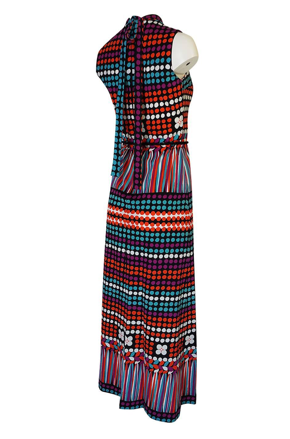 This vintage Lanvin dress has a bright color and print combination on a black base. The jersey fabric it is made of was considered one of the new 