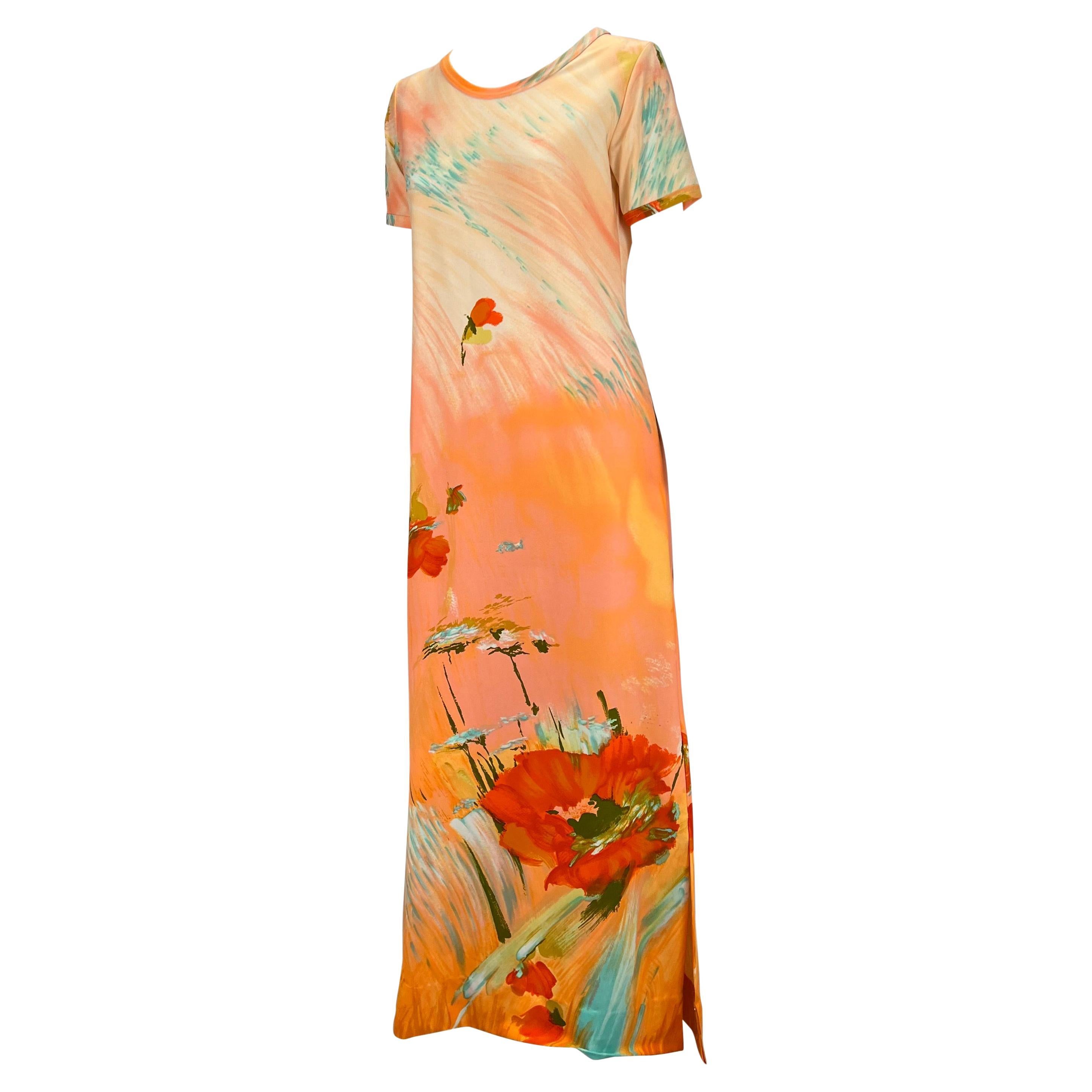 TheRealList presents: a bright pastel floral Lanvin dress. From the 1970s, this maxi dress features short sleeves and a scoop neckline with slits on both sides. The has a floral motif and gives the appearance of watercolor brush strokes. A beautiful