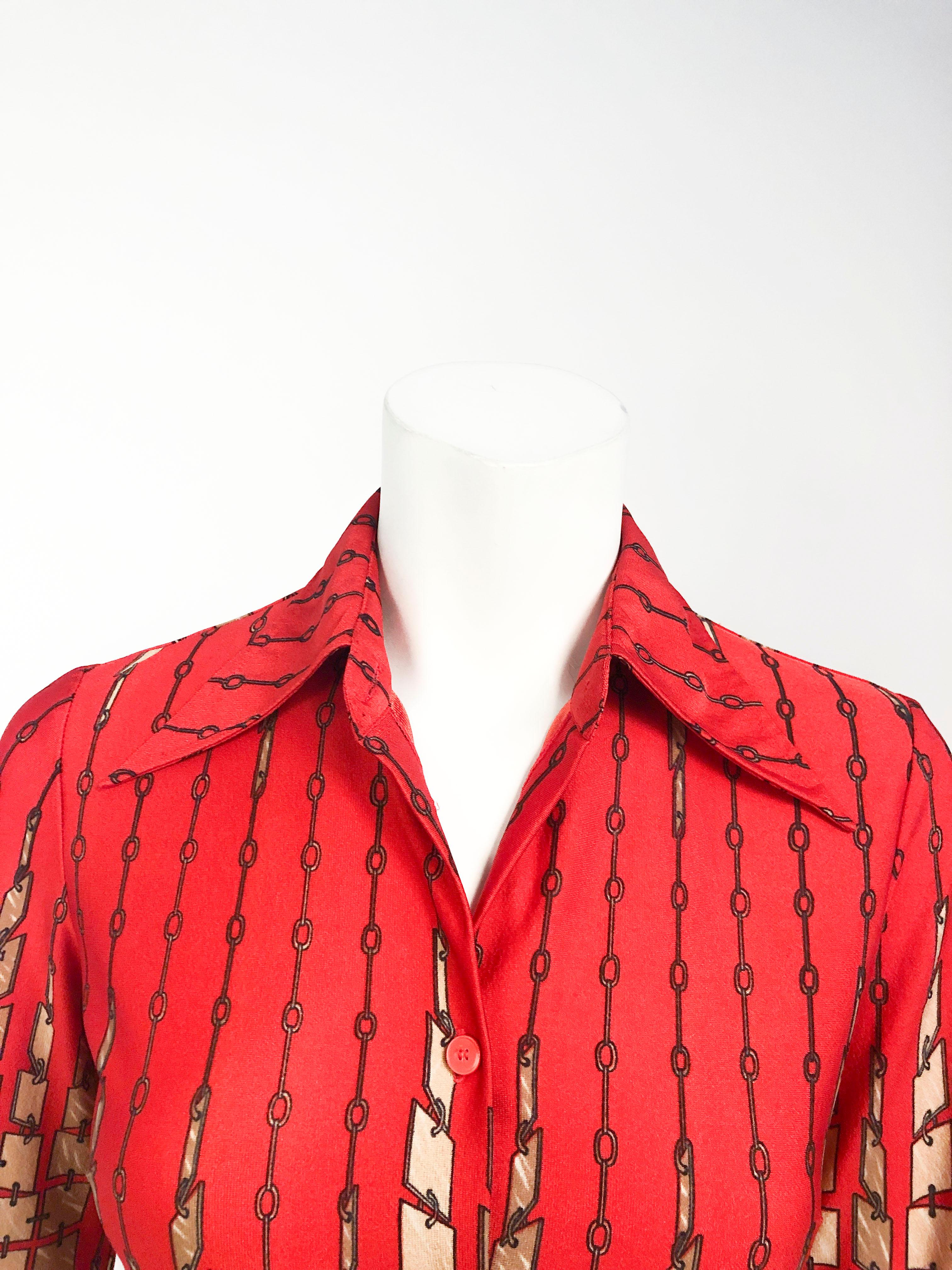 1970s Lanvin red printed shirt with turning tile motif. Accented with butterfly collar, cuffed sleeves, and red buttons. This item is made of a fine knitted polyester.  