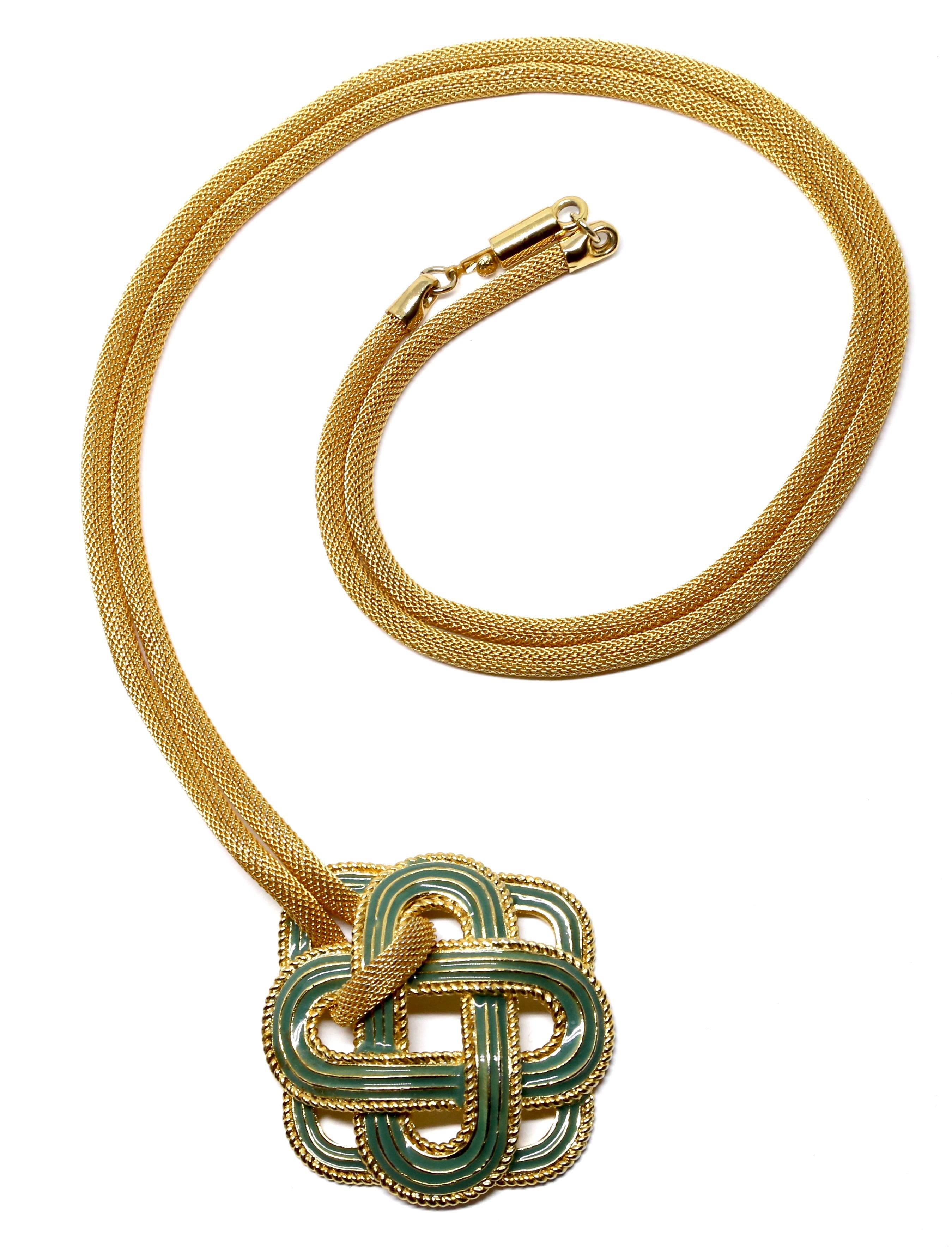 Striking, gilt-metal and turquoise-blue enameled pendant strung on a long gilt-metal woven rope chain from Lanvin dating to the 1970's. Pendant measures approximately 2.25