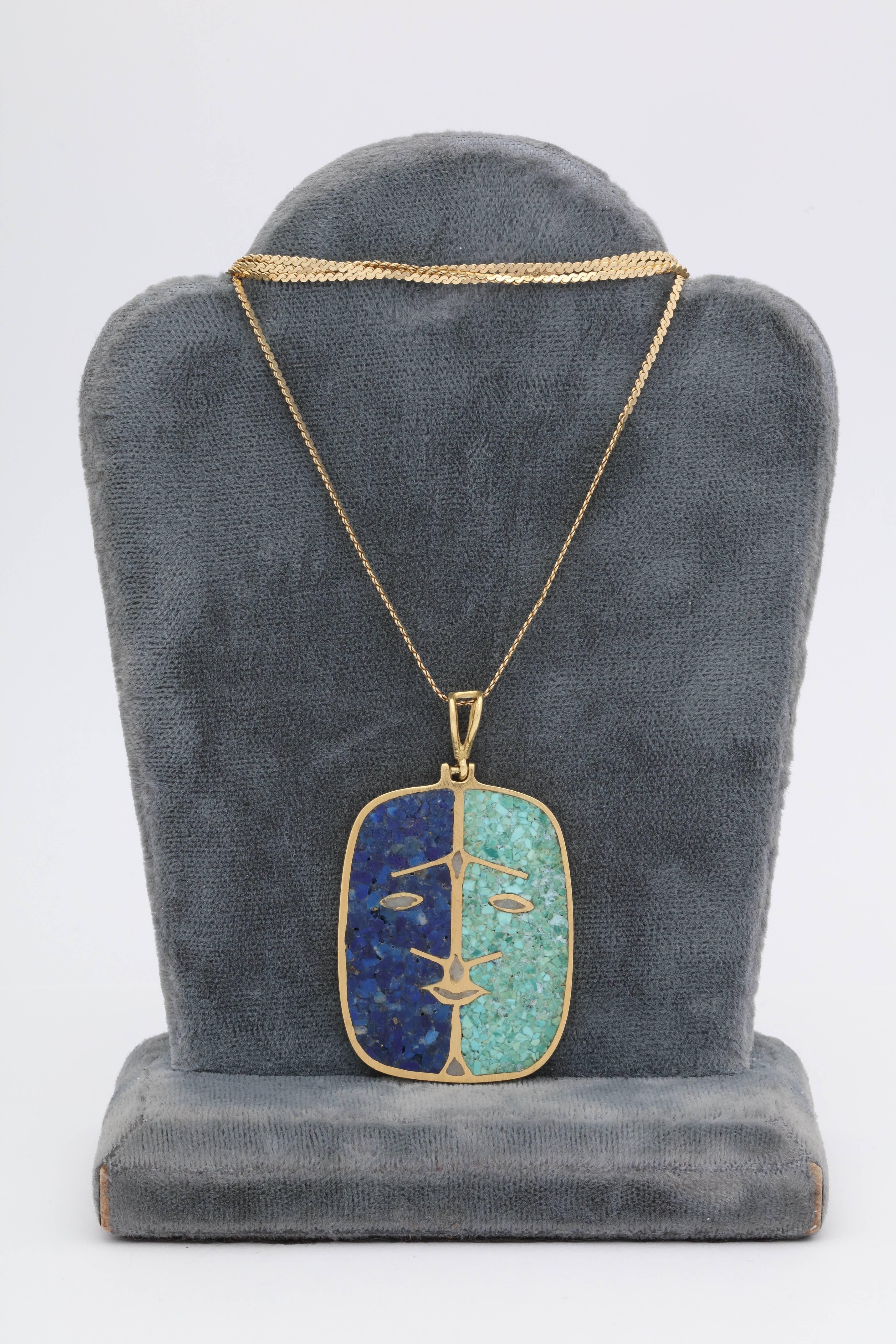 One Unisex Necklace Composed Of A European Made 14kt Yellow Gold Herringbone Chain With A Double Sided Malachite And Lapis Pendant With A Face Detail Design. European Made In The 1970's.