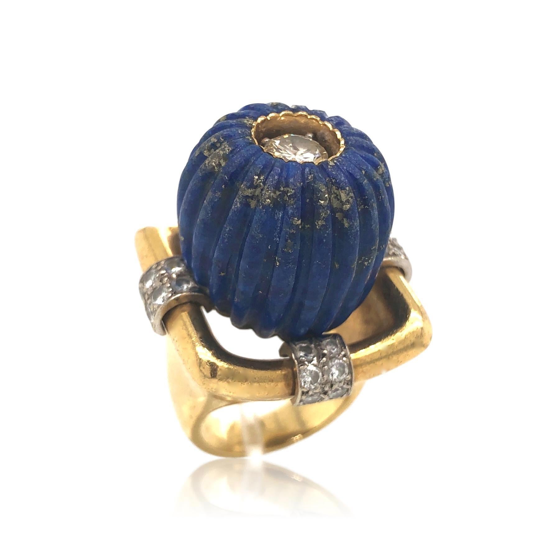 70's Cocktail ring with lapis, gold and diamond. The 18k yellow gold ring shank with a massive 1 3/4
