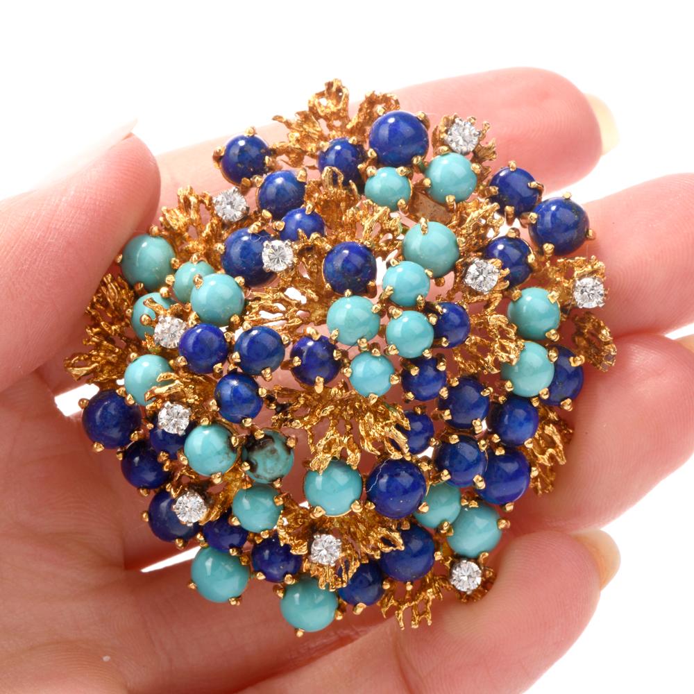 This vintage 1970s brooch was inspired by a nugget-style motif and 

crafted in 43.5 grams of 18K yellow gold.

This brooch pin contains 20 round vibrant brilliant cut diamond prong set and 

weighing appx. 1.20 carats.  Graded G-H color and VS1-VS2