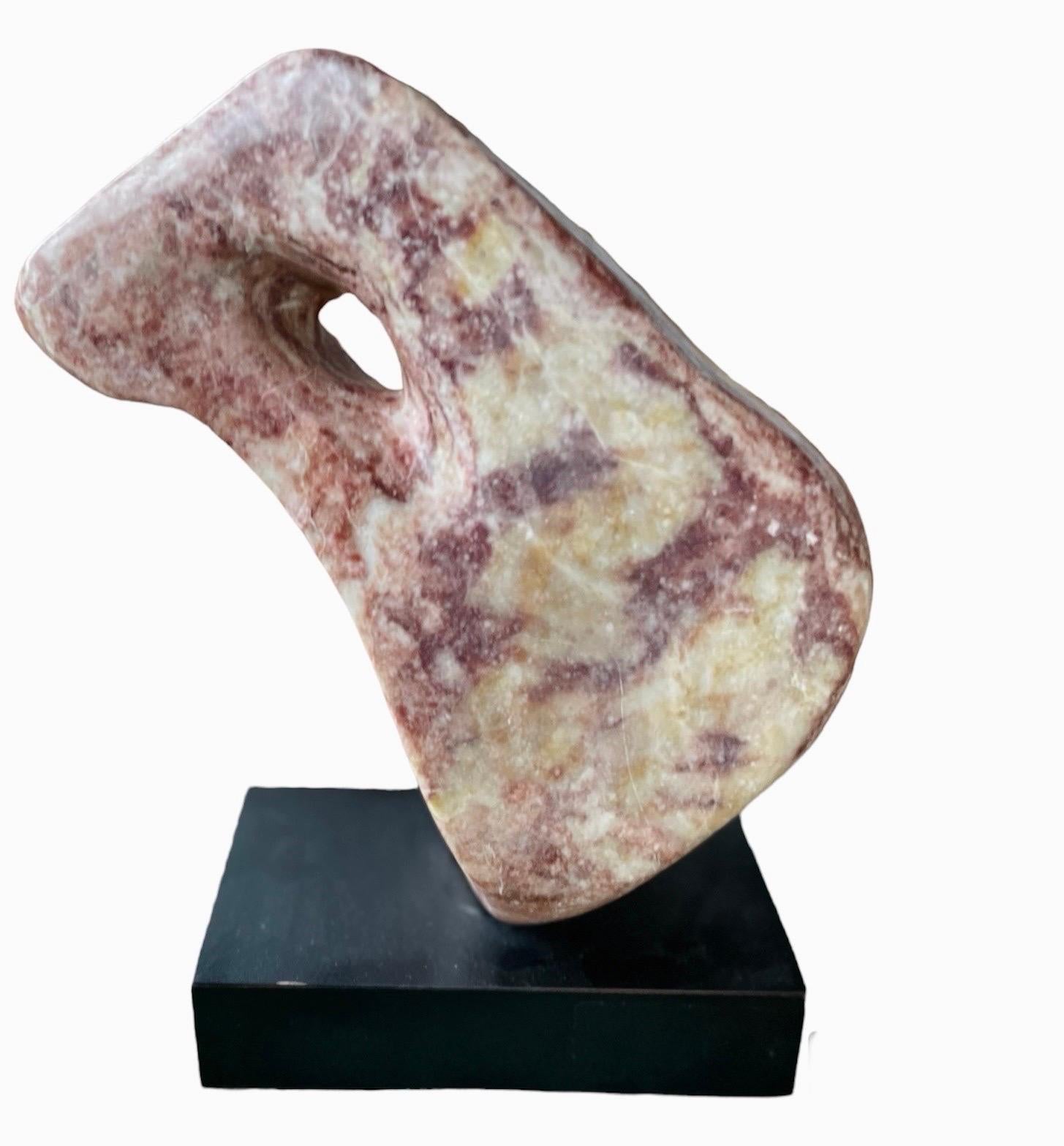  Large abstract red marble sculpture, ca 1970s.

The piece measures 14.75 inches high, 13 inches wide, and 6 inches deep.