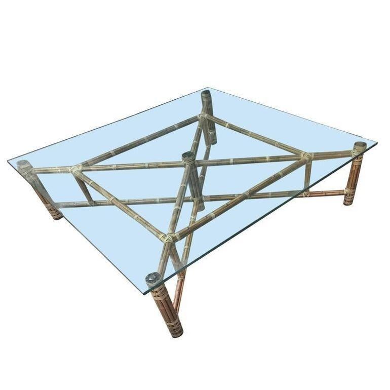 This beautifully restored Paul T. Frankl inspired rattan blends vintage charm with modern comfort. This iconic 1970 square coffee table crafted by John McGuire marries elegance with raw charm, all meticulously refinished to highlight the natural
