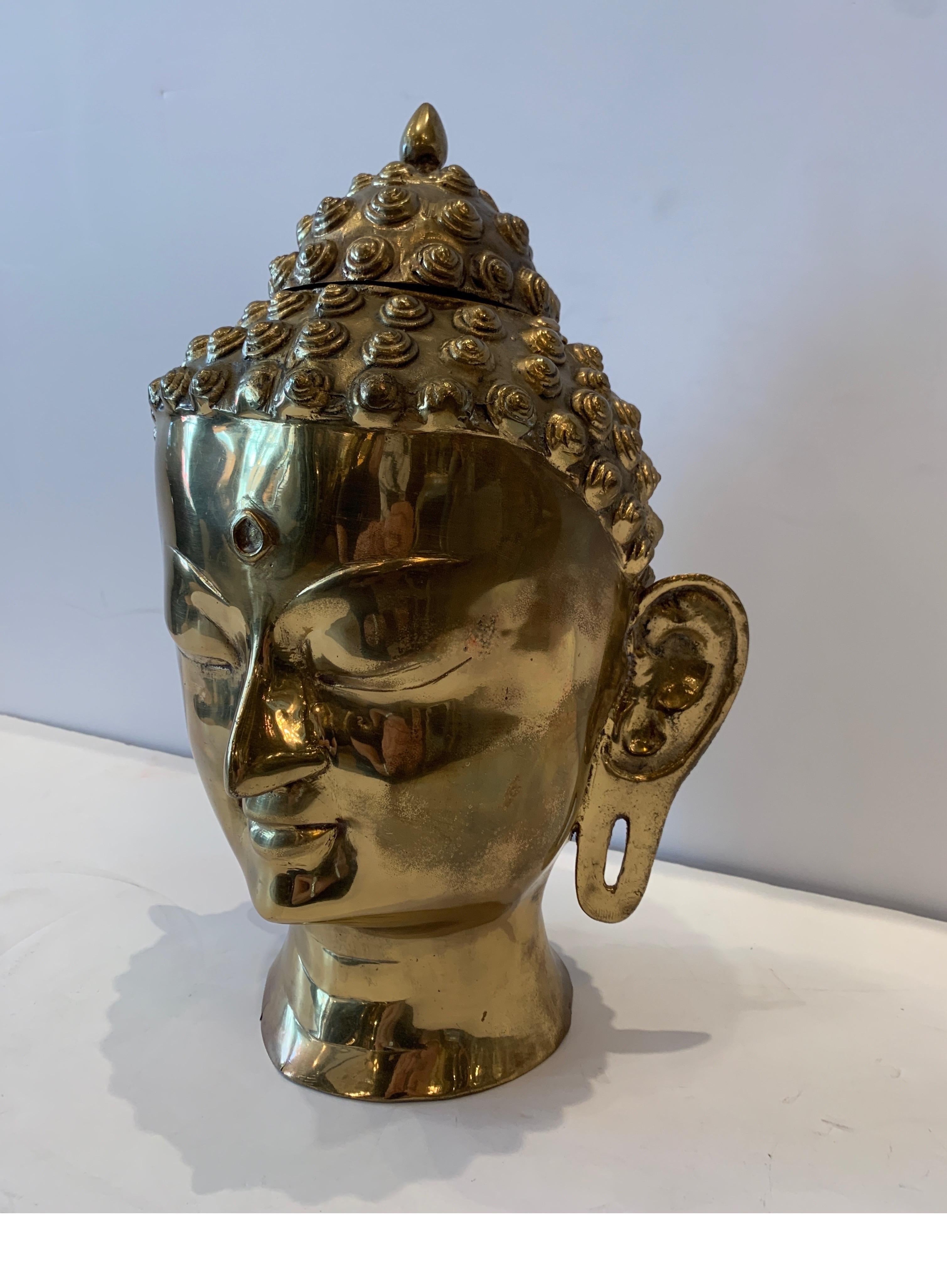 Decorator cast brass Buddha head from Thailand, circa 1970s 16 inches tall minor expected oxidation to the surface.