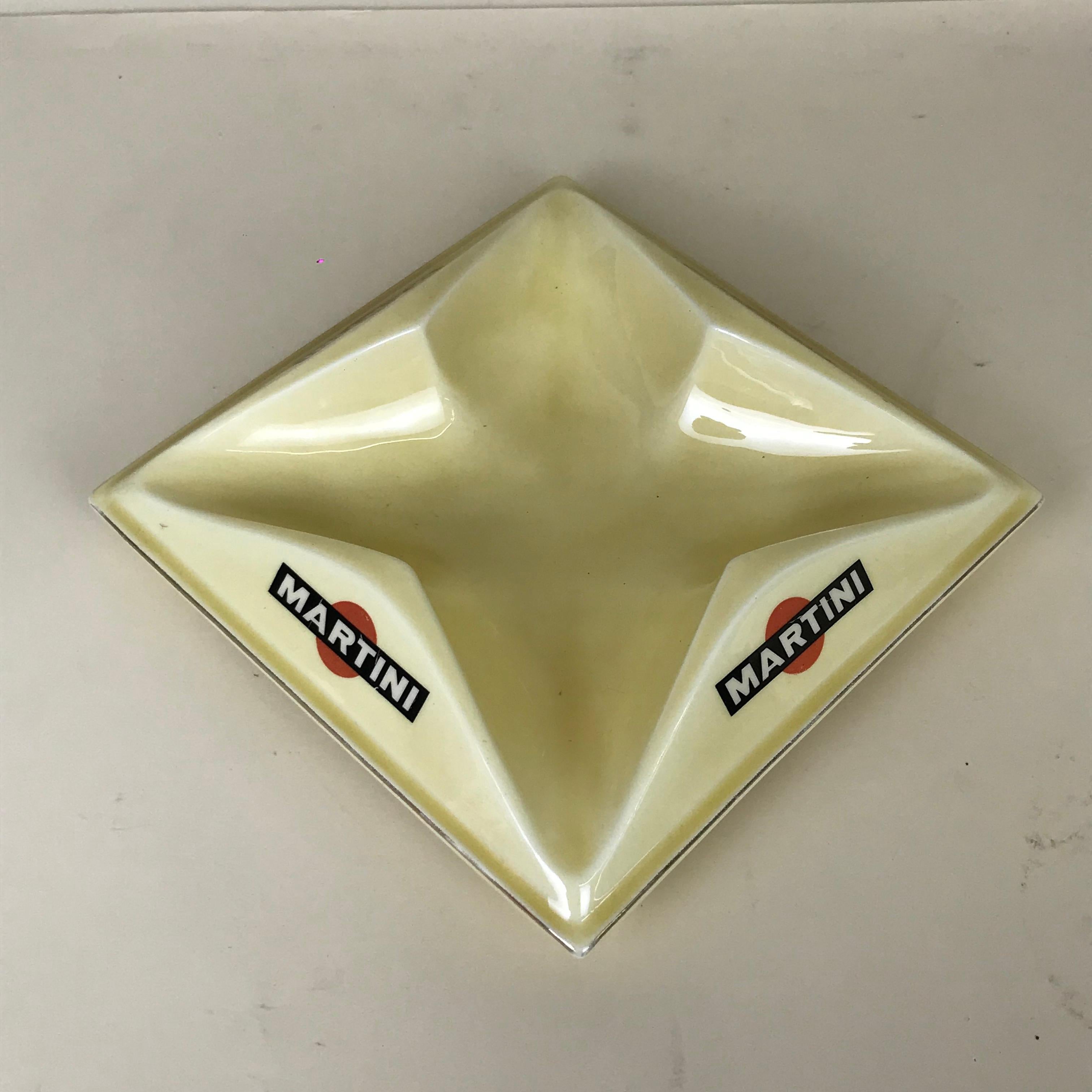 1970s French large cream ceramic bistro ashtray with metal rimmed profile and Martini logo on all four sides.

Marked on bottom: 