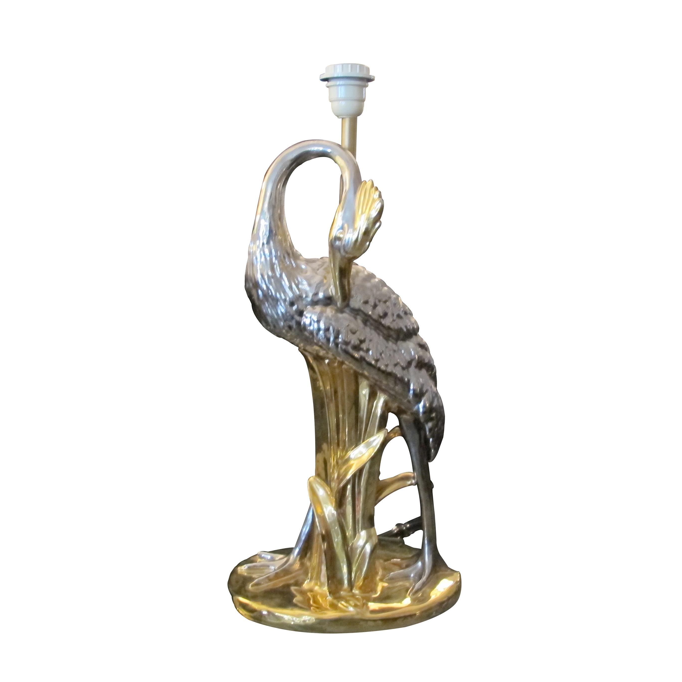 Highly decorative 1970s porcelain table lamp in the shape of a heron, gold and silver colour. The lamp was manufactured by San Marco in Italy. The lamp has been rewired to the UK standard. 

Size: H60 cm without the shade x W30 cm x D18 cm 
light
