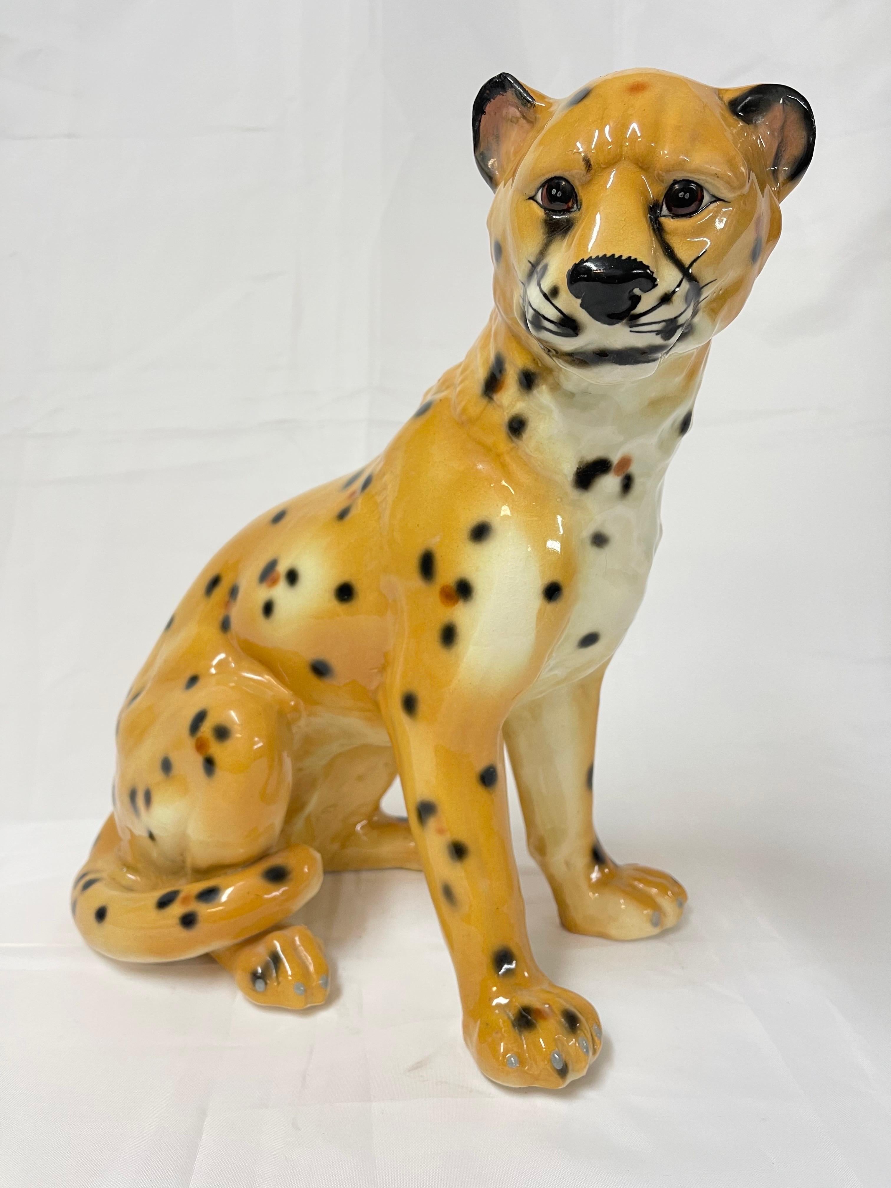 1970's Large Italian Ceramic Cheetah. This fabulous Hollywood Glam sculpture would be the perfect centerpiece. Unmarked but most likely Italian.