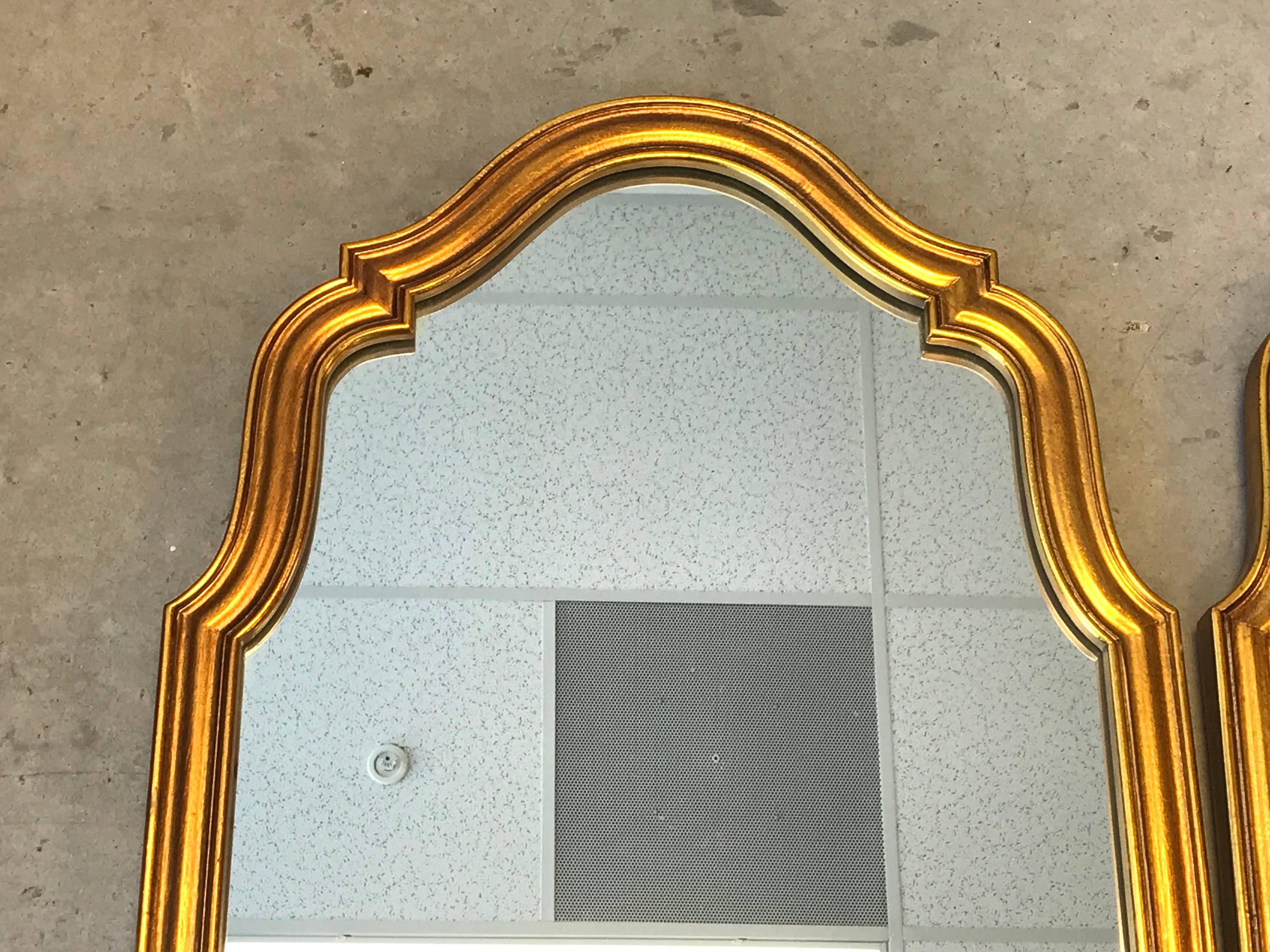 Offered is a gorgeous, pair of 1970s Italian Florentine gilded on resin mirrors. Heavy.