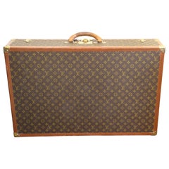 Lot - A VINTAGE LOUIS VUITTON SOFTSIDED SUITCASE, AMERICAN, 1970s