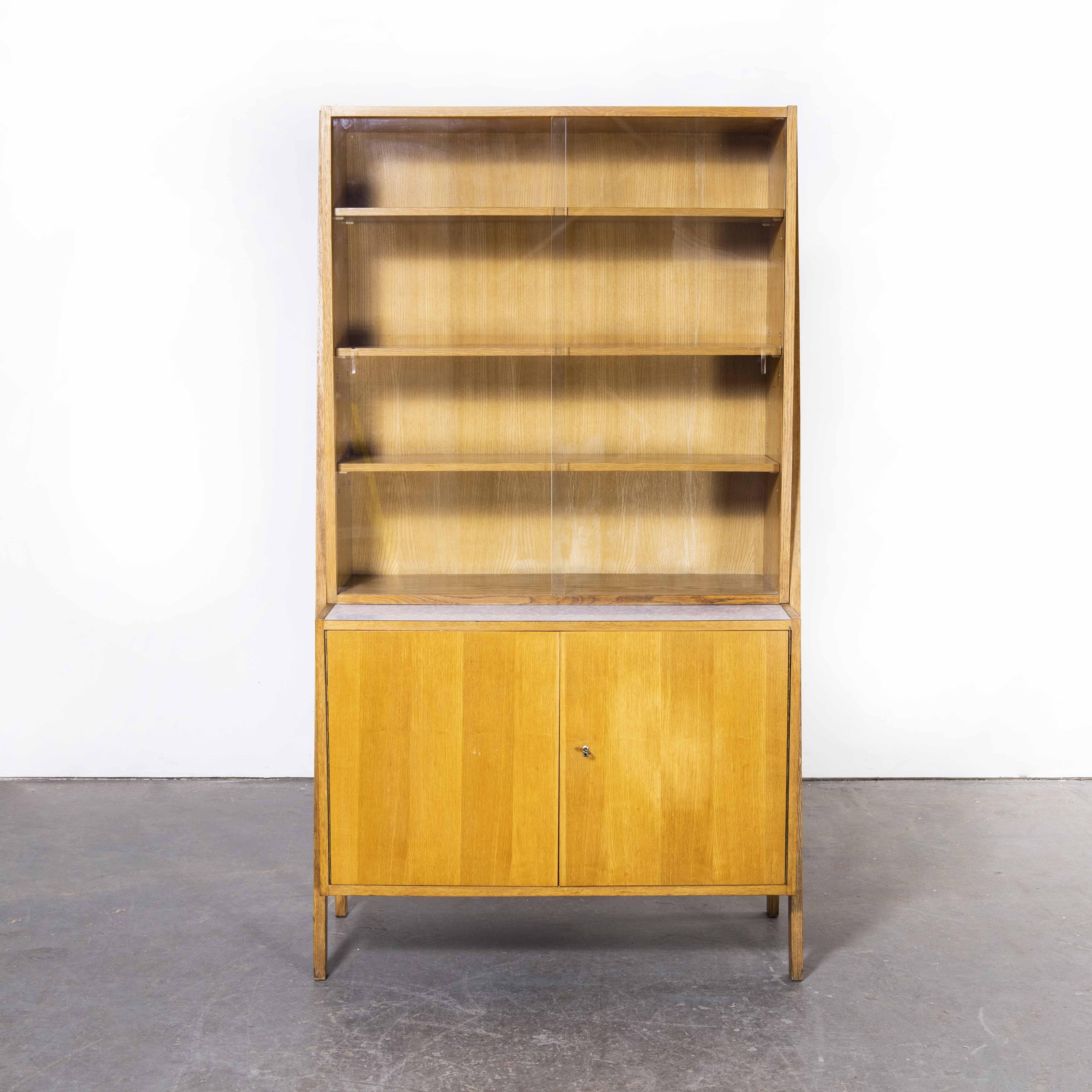 1970’s Large mid century glass fronted bookcase – cabinet
1970’s Large mid century glass fronted bookcase – cabinet. Beautiful simple and classic mid century shelving unit sourced in the Czech Republic. The carcass and external frame are made from