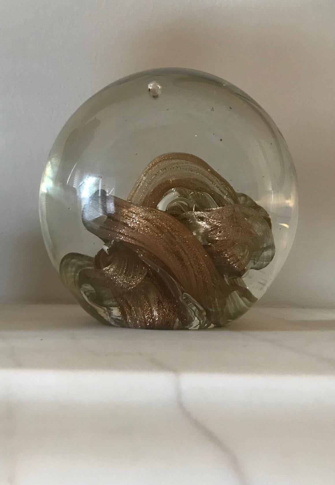 A beautiful large sphere shaped Murano paperweight with gold inclusion swirl detail and good pontil mark.