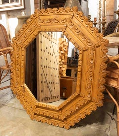 1970s Large Octagonal Mirror with a Baroque-style Carved Wooden Frame